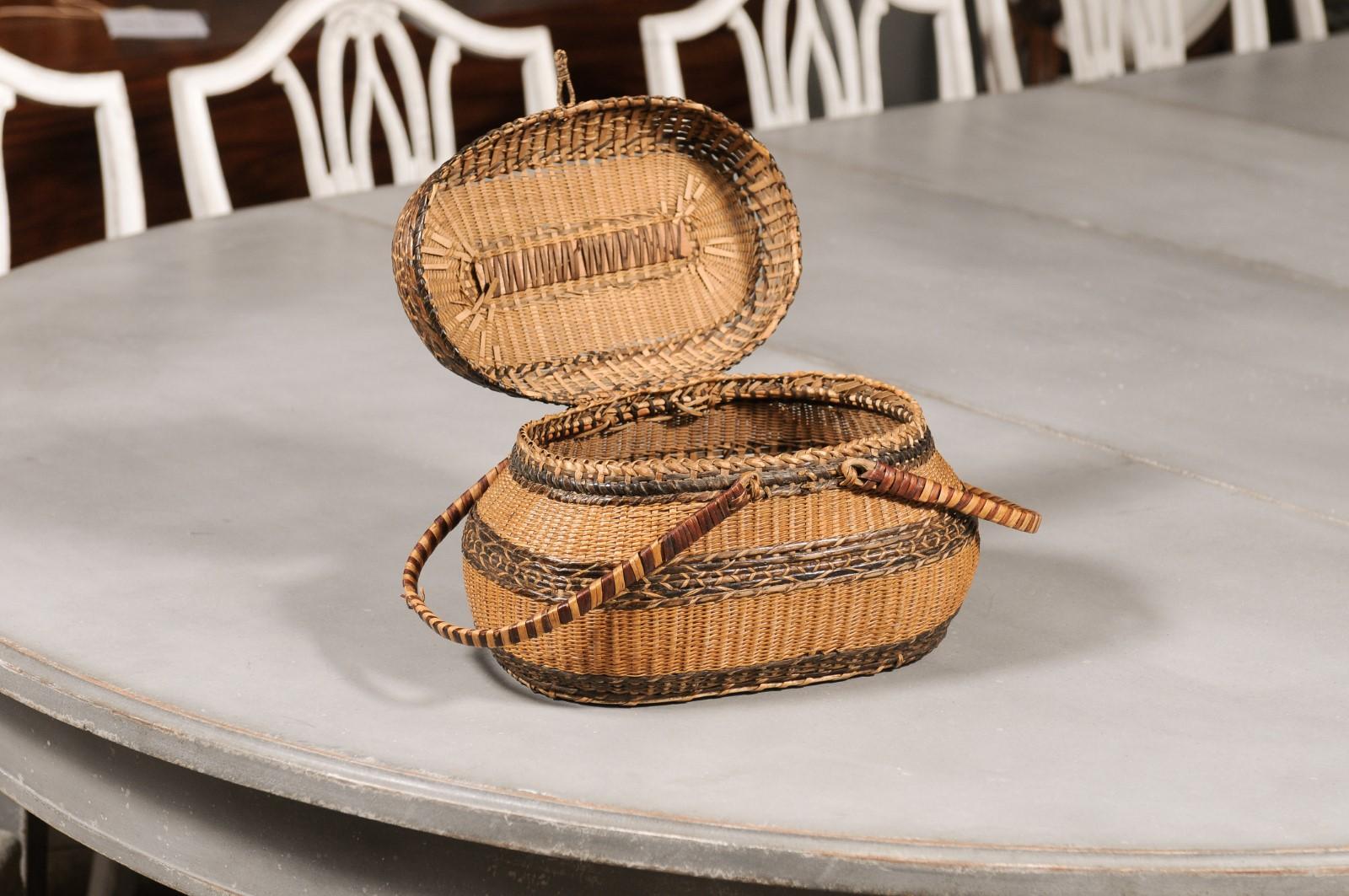 Rustic Swedish 1890s Oval Two-Toned Wicker Basket with Large Handles In Good Condition For Sale In Atlanta, GA
