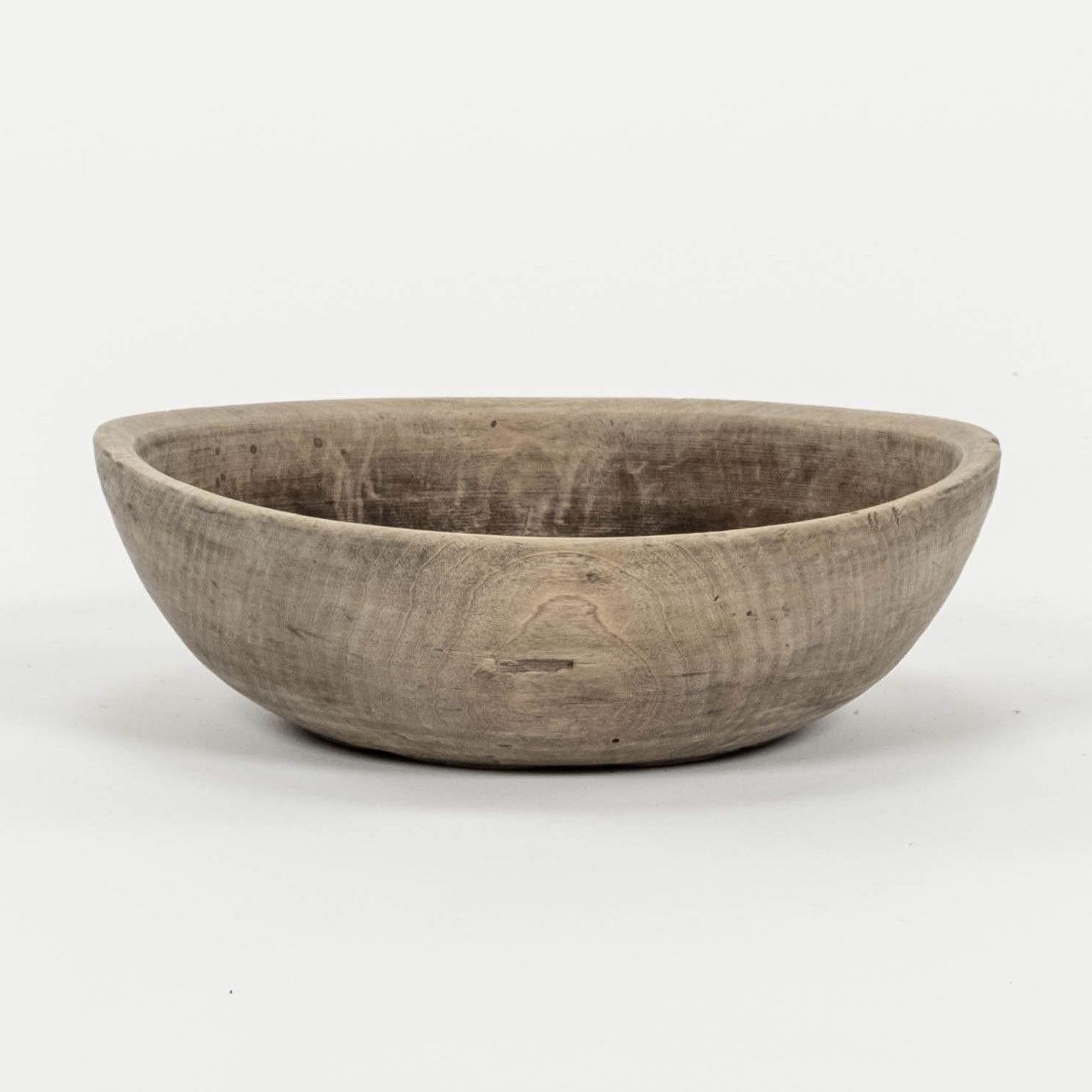 Rustic Swedish herb turned bowl with maker's brands. Incised line markings from lathe run counter to the grain and wood striation of bowl creating a subtle, gorgeous patterned effect across surface. Finish is a dry grayish mid-brown color. Marked