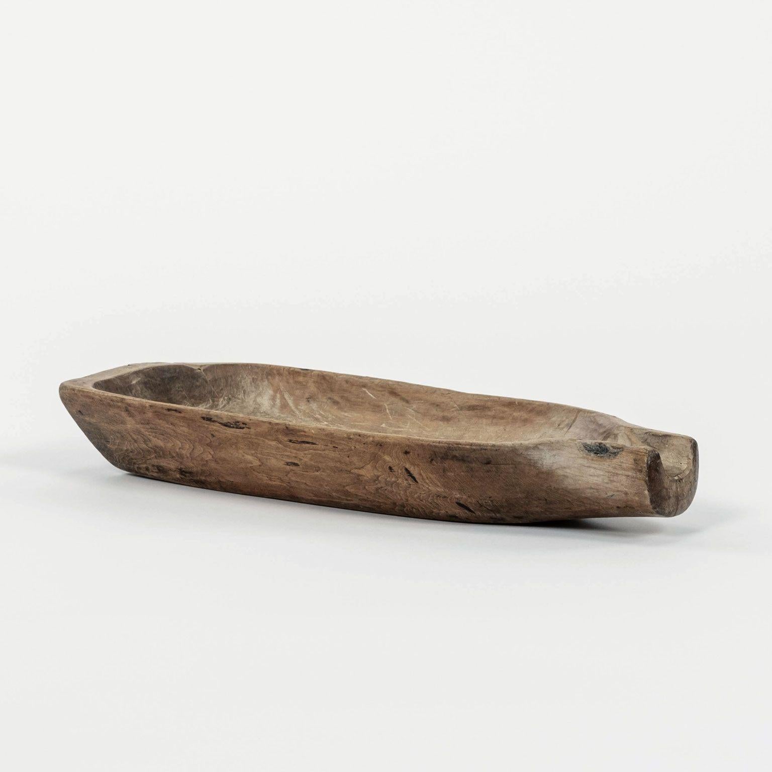 Rustic Swedish spouted salting trough hand-carved from bleached wood, dated 1855. Runic characters inscribed upon underside.

Note: Due to regional changes in humidity and climate during shipping, antique wood may shrink and/or split along its