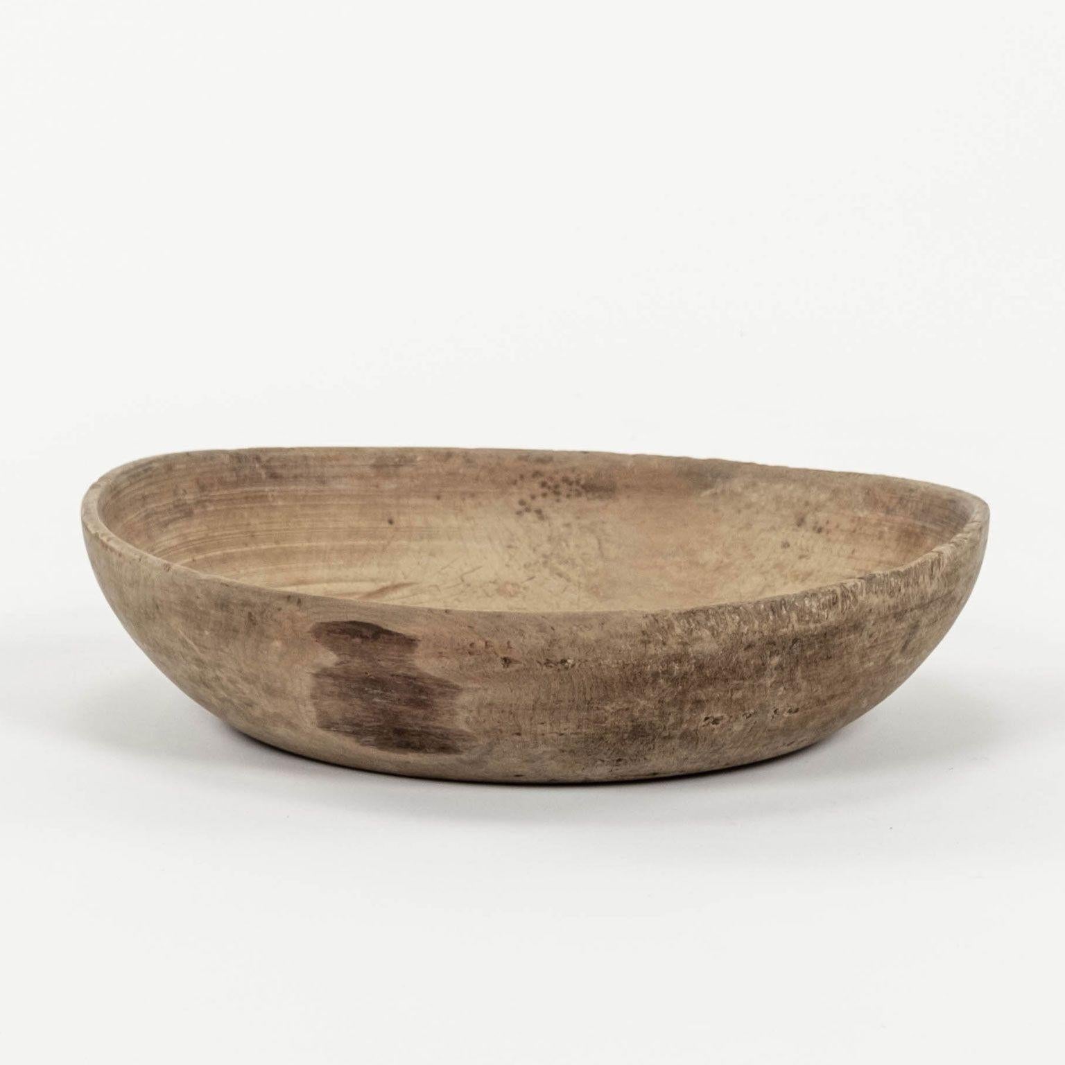 Rustic Swedish turned wooden bowl dating to the mid-to-late 19th century. Excellent dry mid-brown patina and decorative incised line marks from the turning process.

Note: Due to regional changes in humidity and climate during shipping, antique wood