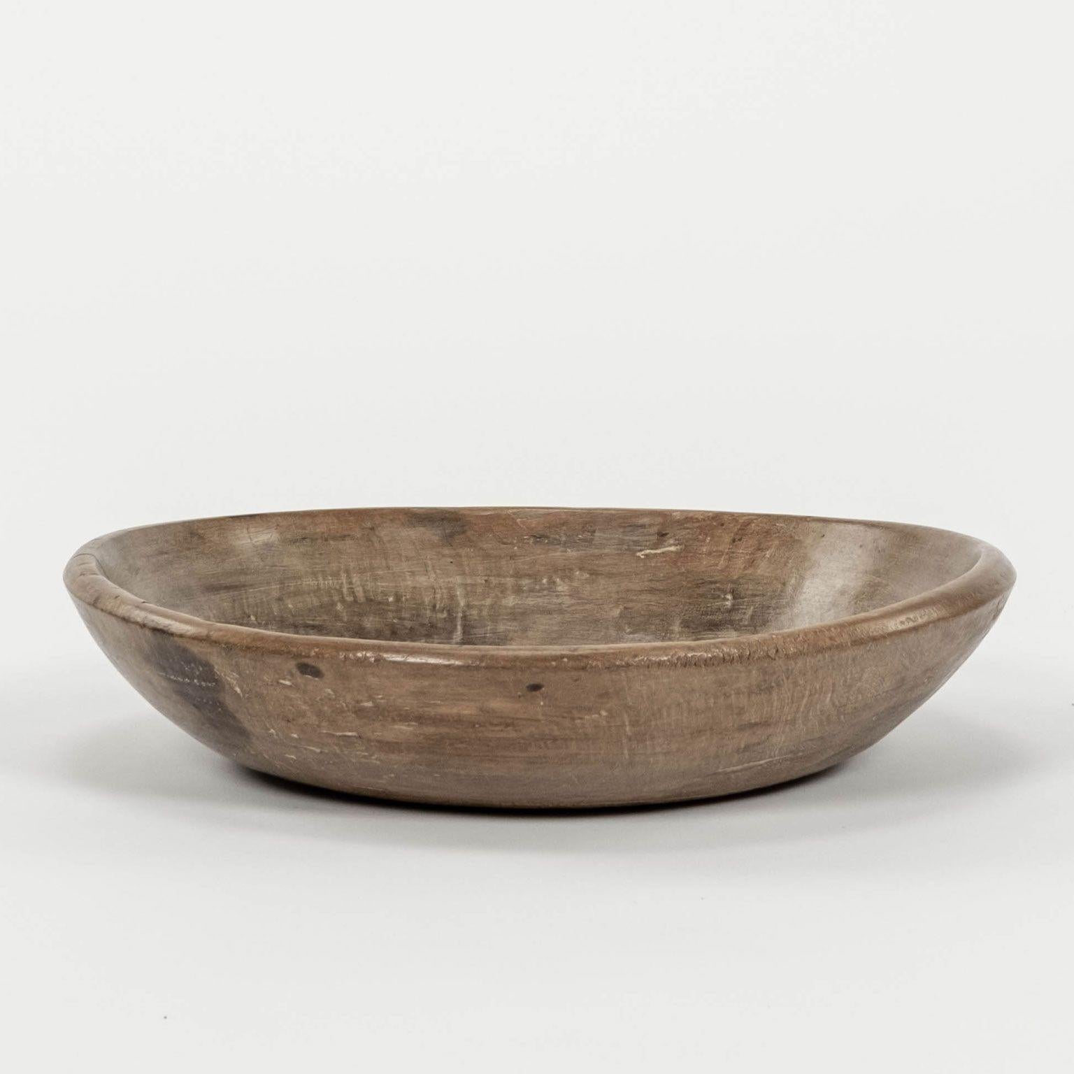 Rustic Swedish turned wooden bowl in brown waxed finish.