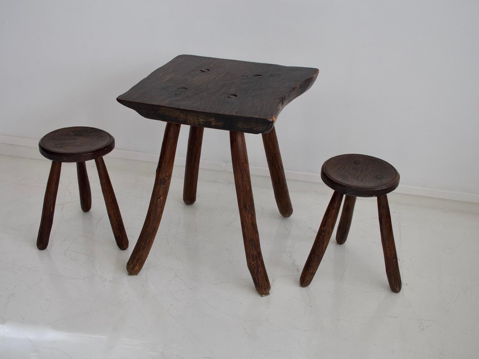 French Rustic Table and Two Tripod Stools of Profiled Wood Logs
