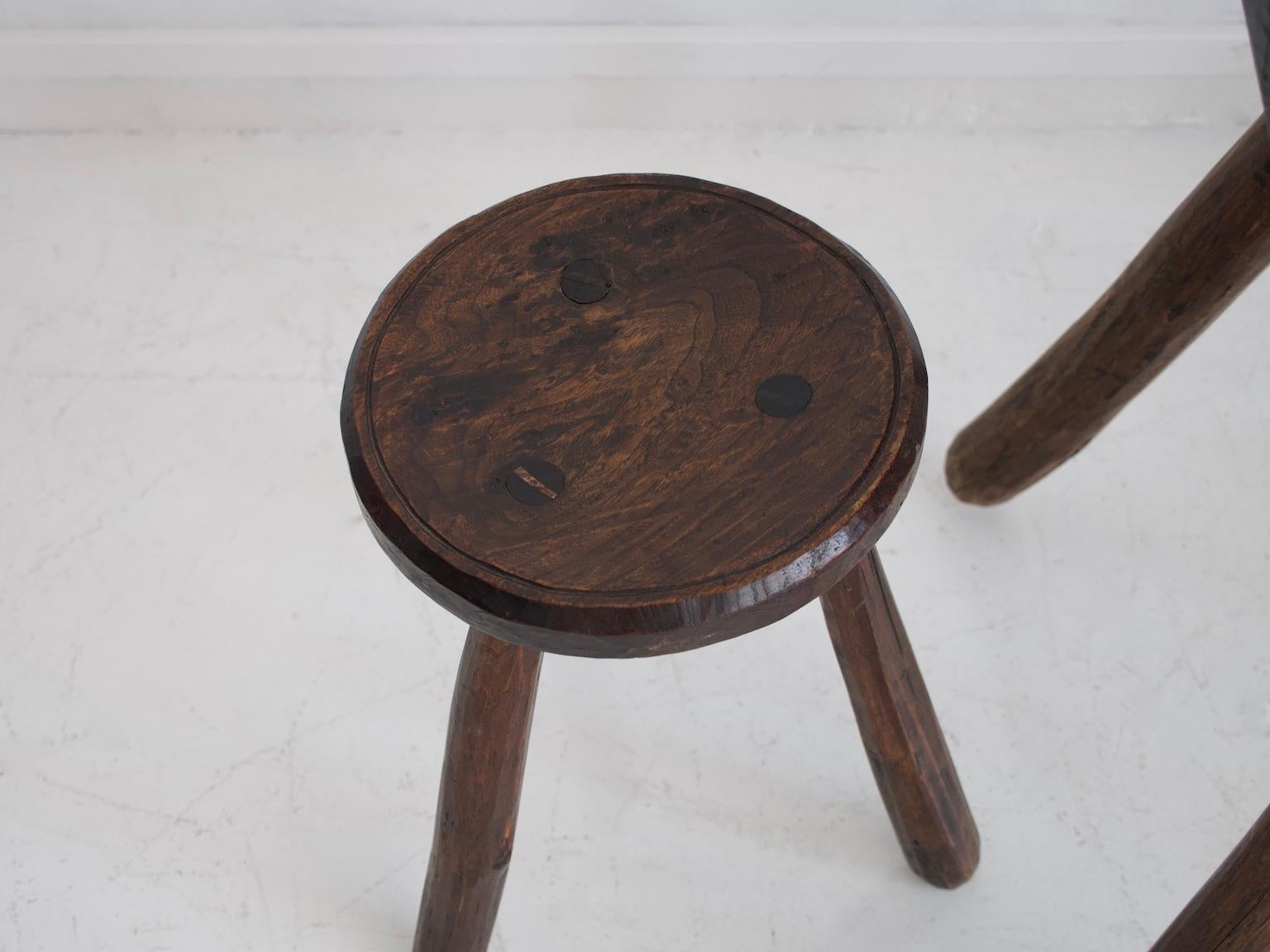 20th Century Rustic Table and Two Tripod Stools of Profiled Wood Logs