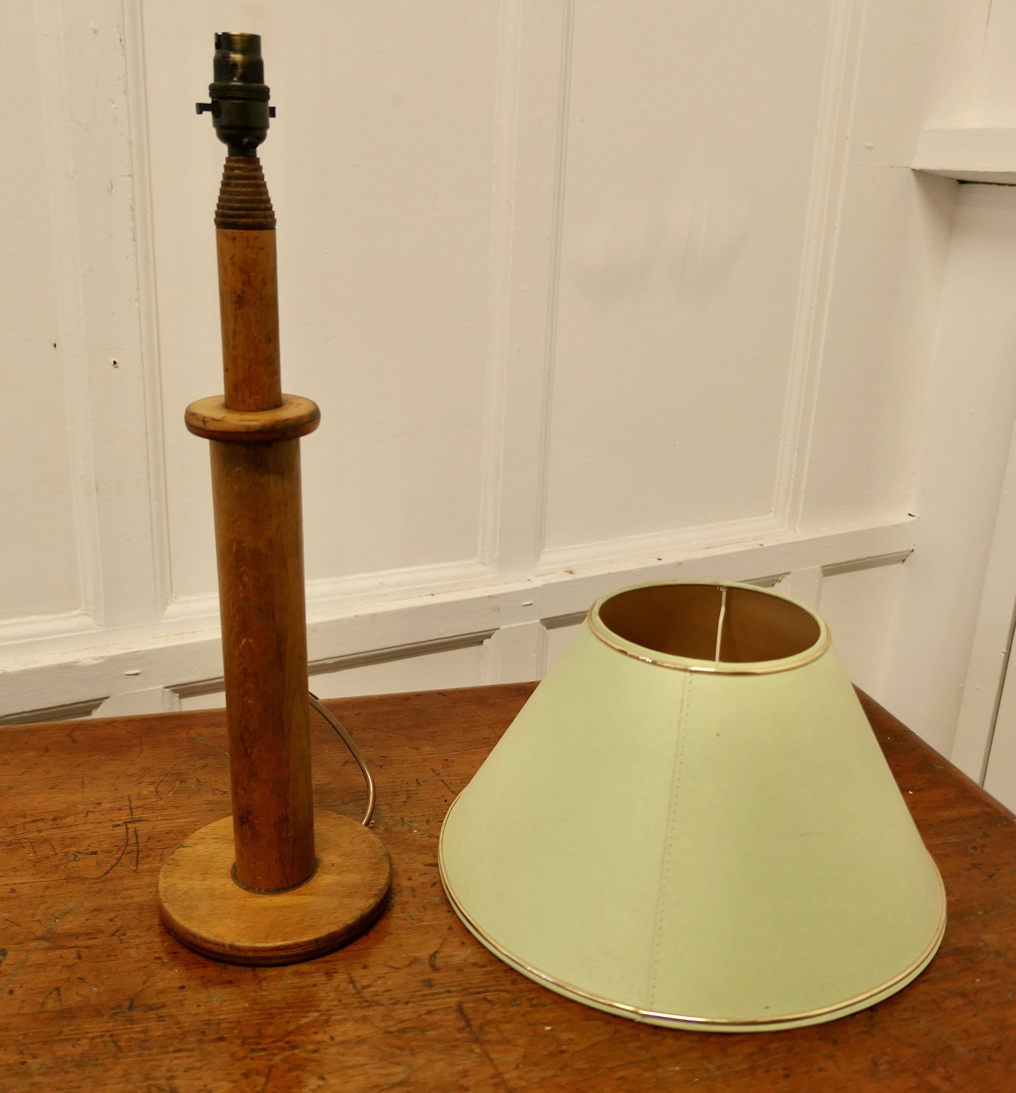 Rustic Table Lamp Made From a Wool Bobbin

A good attractive if rustic table lamp made in beech from a mill bobbin, tall and sturdy and it comes with pale green linen covered shade
The Lamp is 26” high, 6” diameter made the shade is 14” in