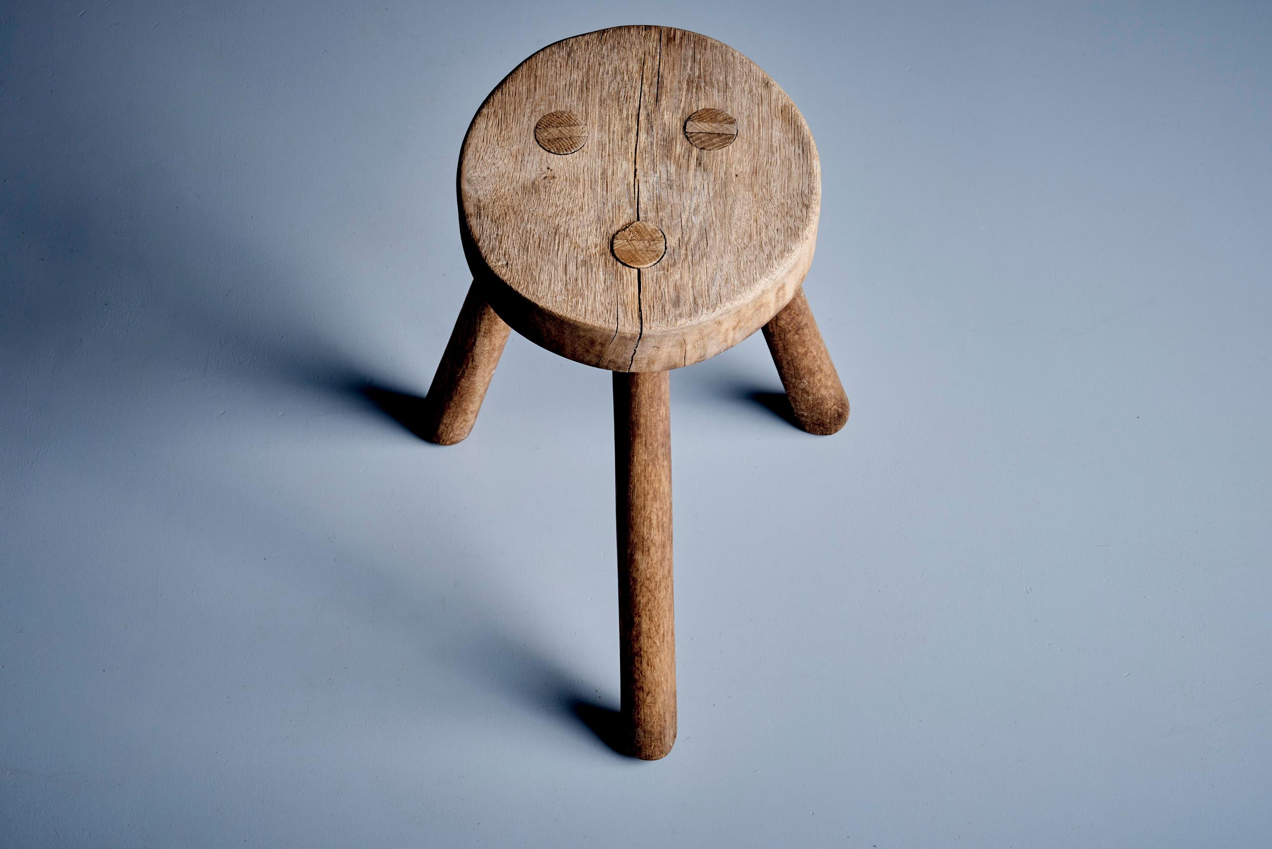 Handcrafted from solid oak with dowel joinery and a beautifully aged patina, this sculptural stool features a thick round seat and tapered legs. A timeless accent piece—ideal as a side table or occasional seat. Vintage condition with minor wear