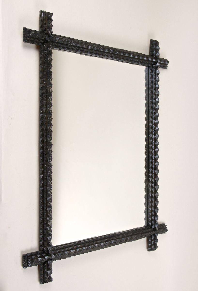 Fantastic rustic Tramp Art wall mirror from the late 19th century around 1880 in Austria. This rural mirror shows traditional chip carving, the well known 