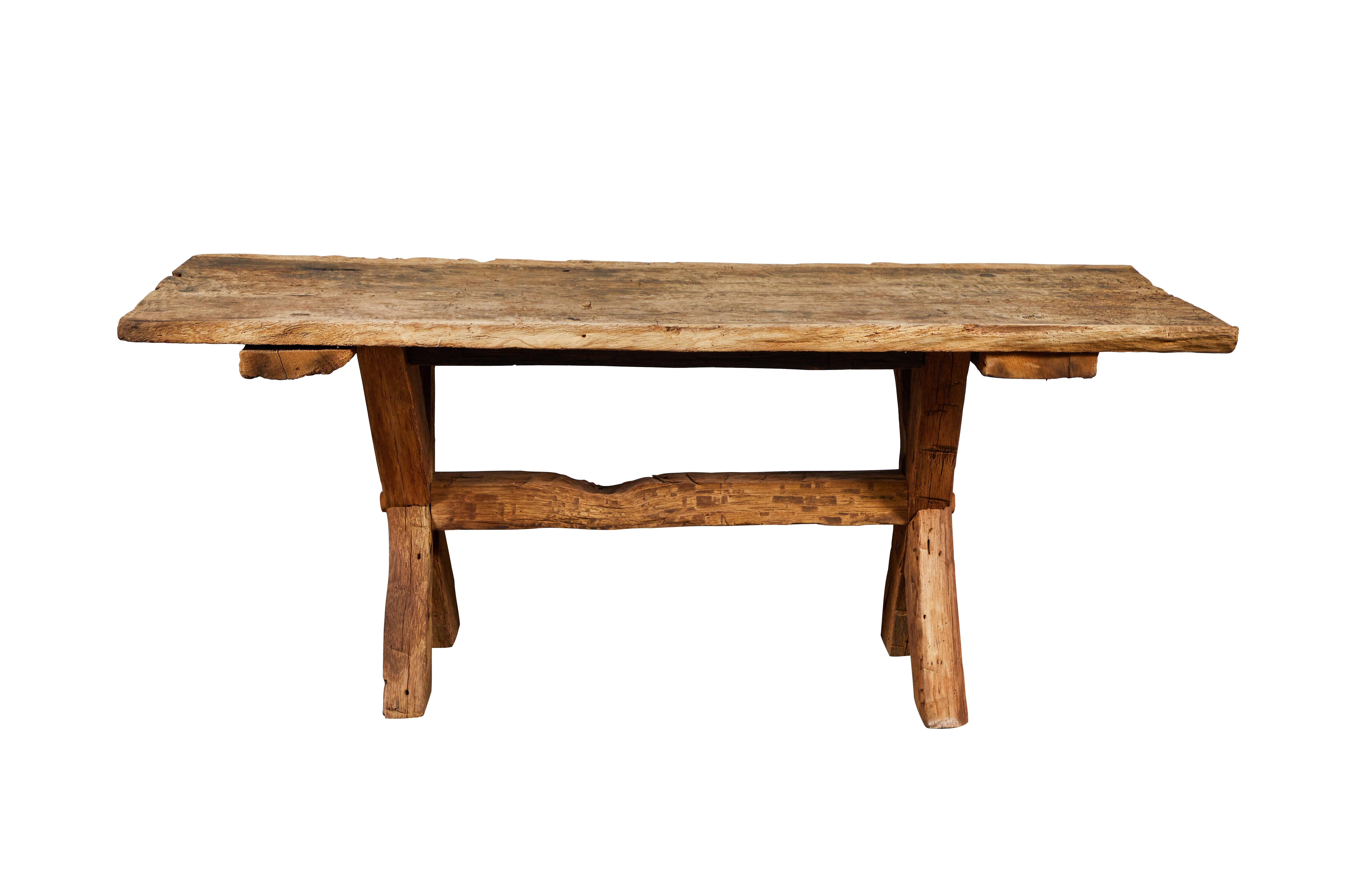Rugged and chunky rustic trestle base console table, has a thin top. The piece can be used as a communal table or used as a console.