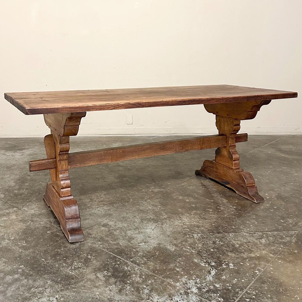 Rustic Trestle Dining Table was crafted from thick planks of solid oak to literally last for generations.  The plank top is so sturdy, a supporting apron is unnecessary, providing more knee clearance than other designs.  Support is provided by