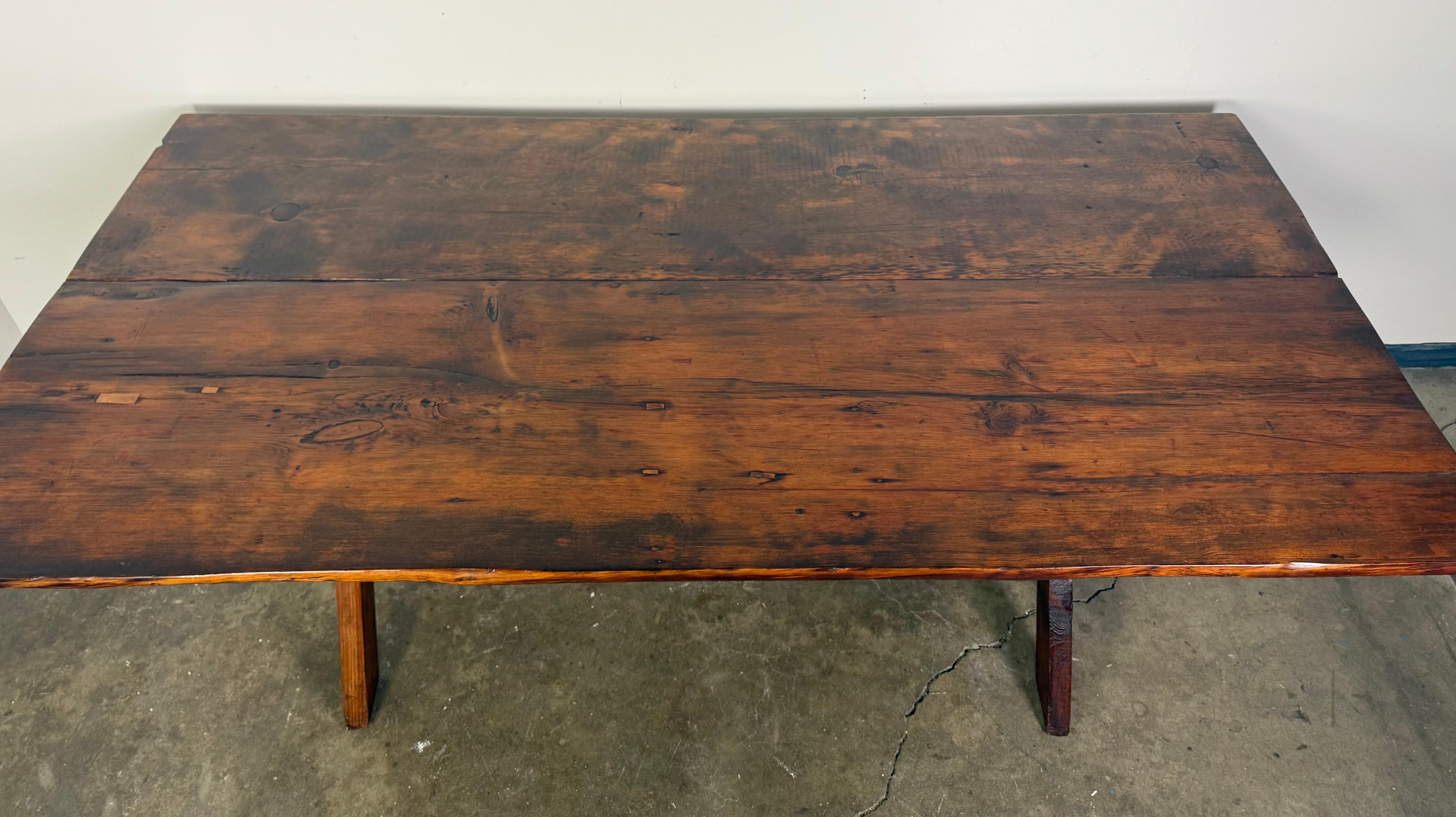 Rustic Trestle Dining Table with Handcrafted Plank Top, Mid-20th Century In Distressed Condition For Sale In Los Angeles, CA