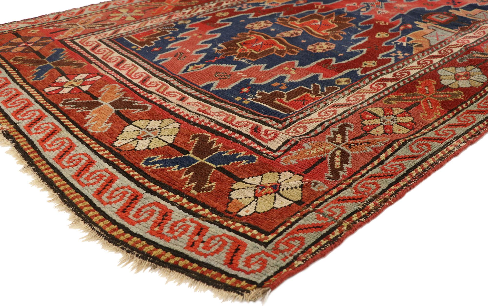 73080 Antique Caucasian Kazak Rug, 04’00 x 08’00.
Bold and rustic, this hand-knotted wool antique Caucasian Kazak rug features a robust composition. Two jagged edge lozenge medallions connect at one end and fill the Kazak rug field in brilliant