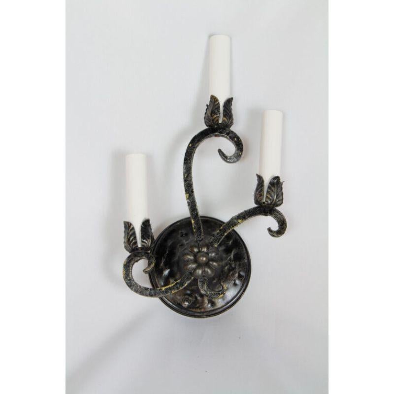 Rustic Vintage black hammered metal sconces, a set of four. Cleaned and sealed original paint, rewired with new sockets, candle covers and hanging hardware. New switch on backplate. Italian, mid-20th century. Price is per sconce.

Dimensions: