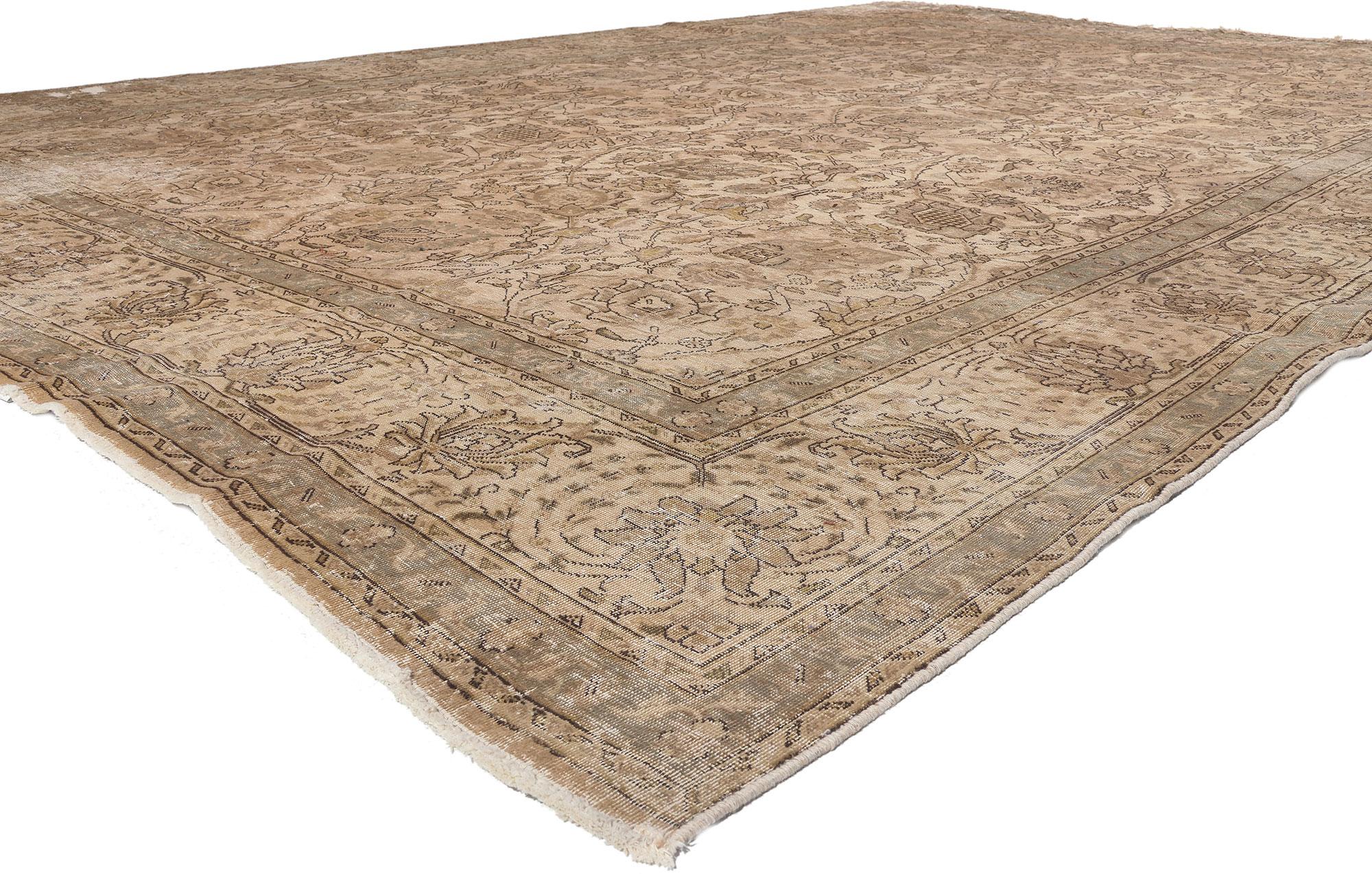 78583 Distressed Vintage Persian Tabriz Rug, 11'02 x 15​'06. 
Warm bucolic charm meets rustic sensibility in this distressed vintage Persian Tabriz rug. The weathered botanical design and faded earthy woven into this piece work together creating a