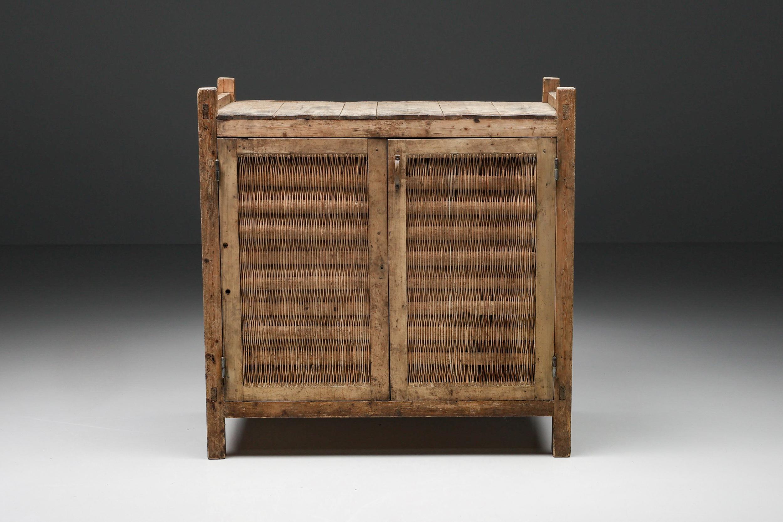 Rustic Wabi-Sabi High Board, Cabinet, Pantry cabinet, Cheese cabinet, Haute-Savoie, Wicker, 1930's; 

Pantry cabinet. Haute-Savoie. With a peasant look, roughly built, this type of furniture is in fact a very ingenious achievement. It finds its