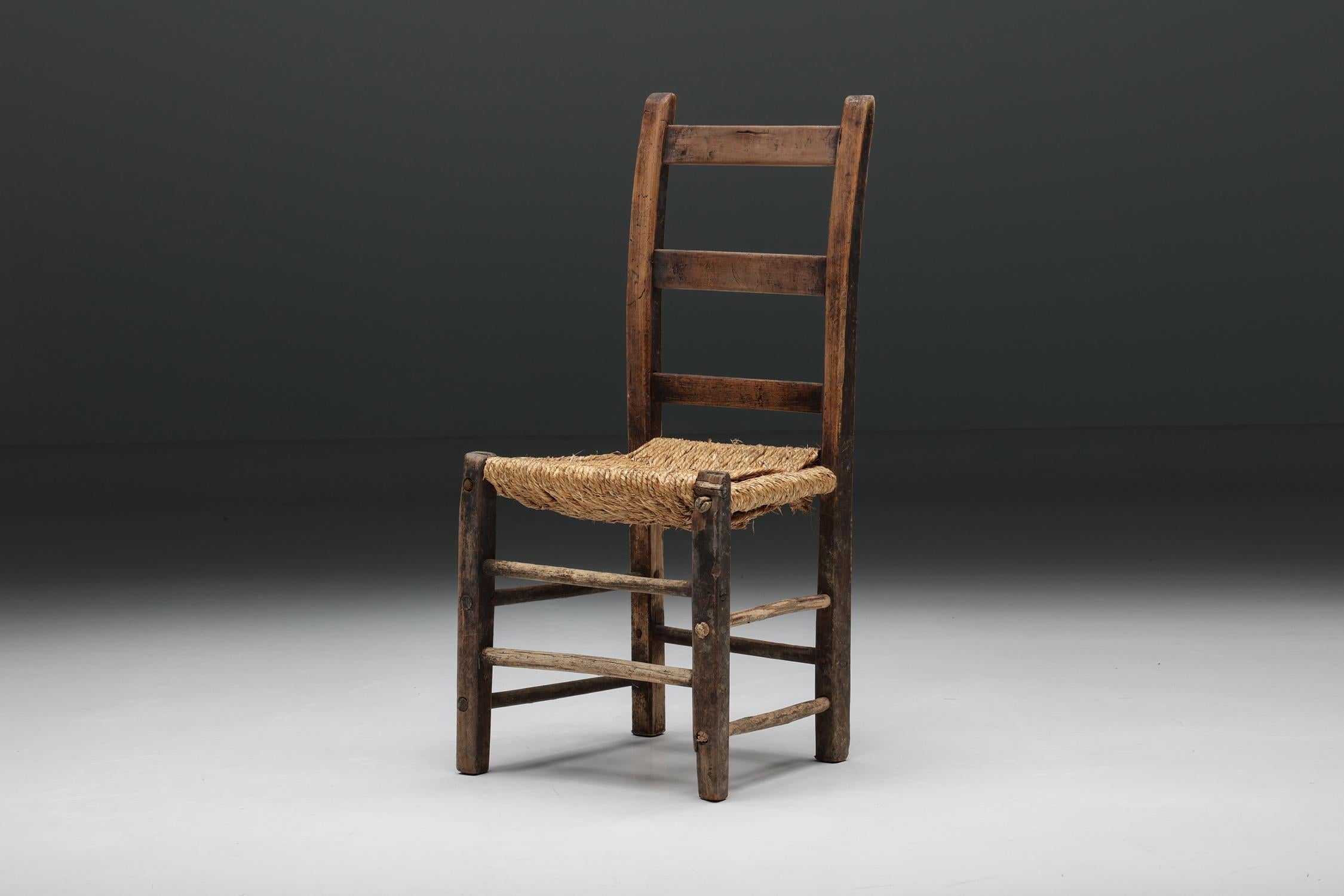 Rustic; Wood; Cord; Wabi Sabi; Rattan; dining chair; side chair; France; French Craftsmanship; 1940s; Mid-Century Modern; 

Rustic chair with comfortable cord seating and an imperfect, wabi-sabi wooden structure. A remarkable example of French