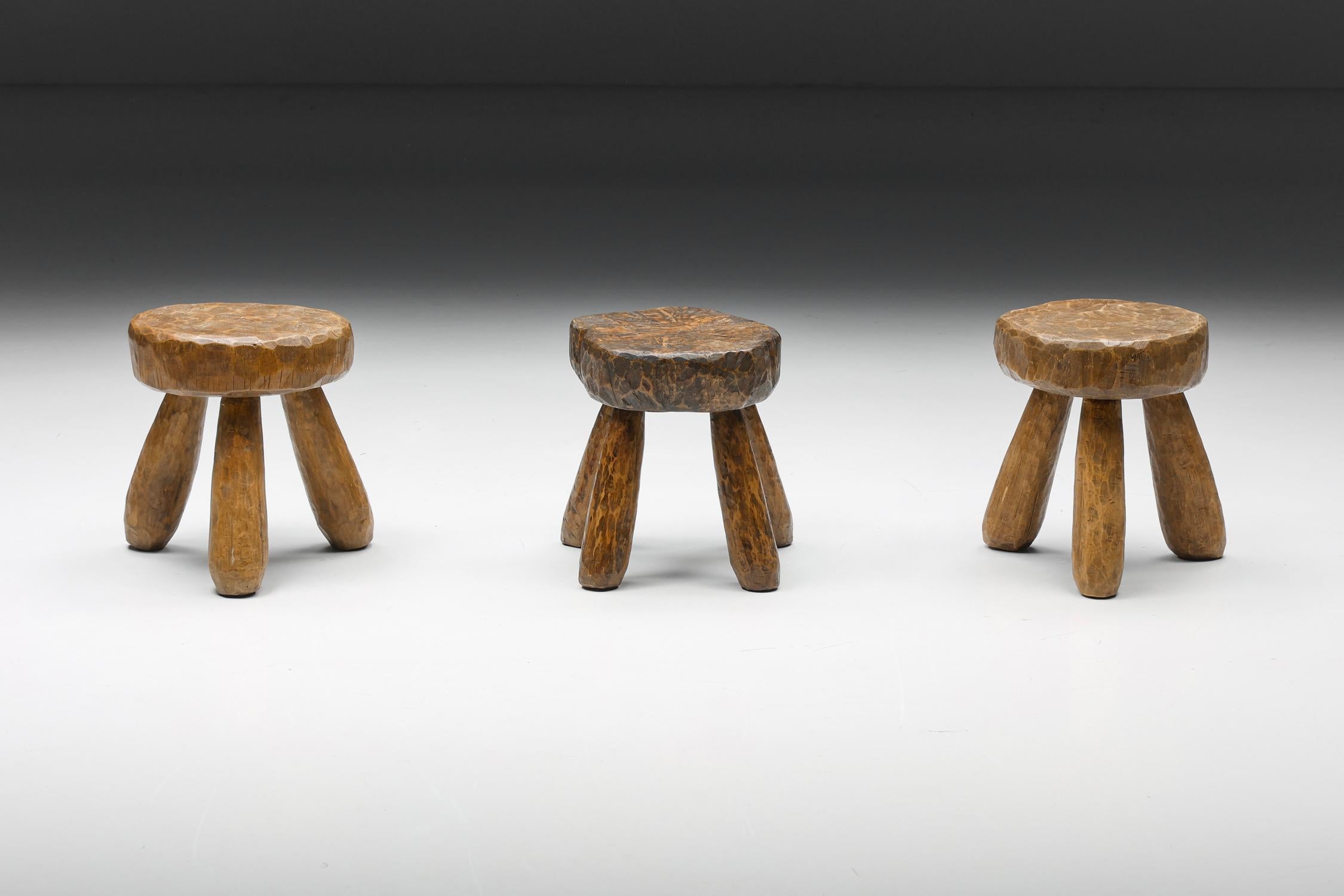 Rustic Wabi-Sabi Round Wooden Stools, France, 1950's

This series of rustic wooden stools have a three-legged base and round seating. Can also be used as small side tables. Each stool is unique because of its wood patina. These wabi-sabi items would