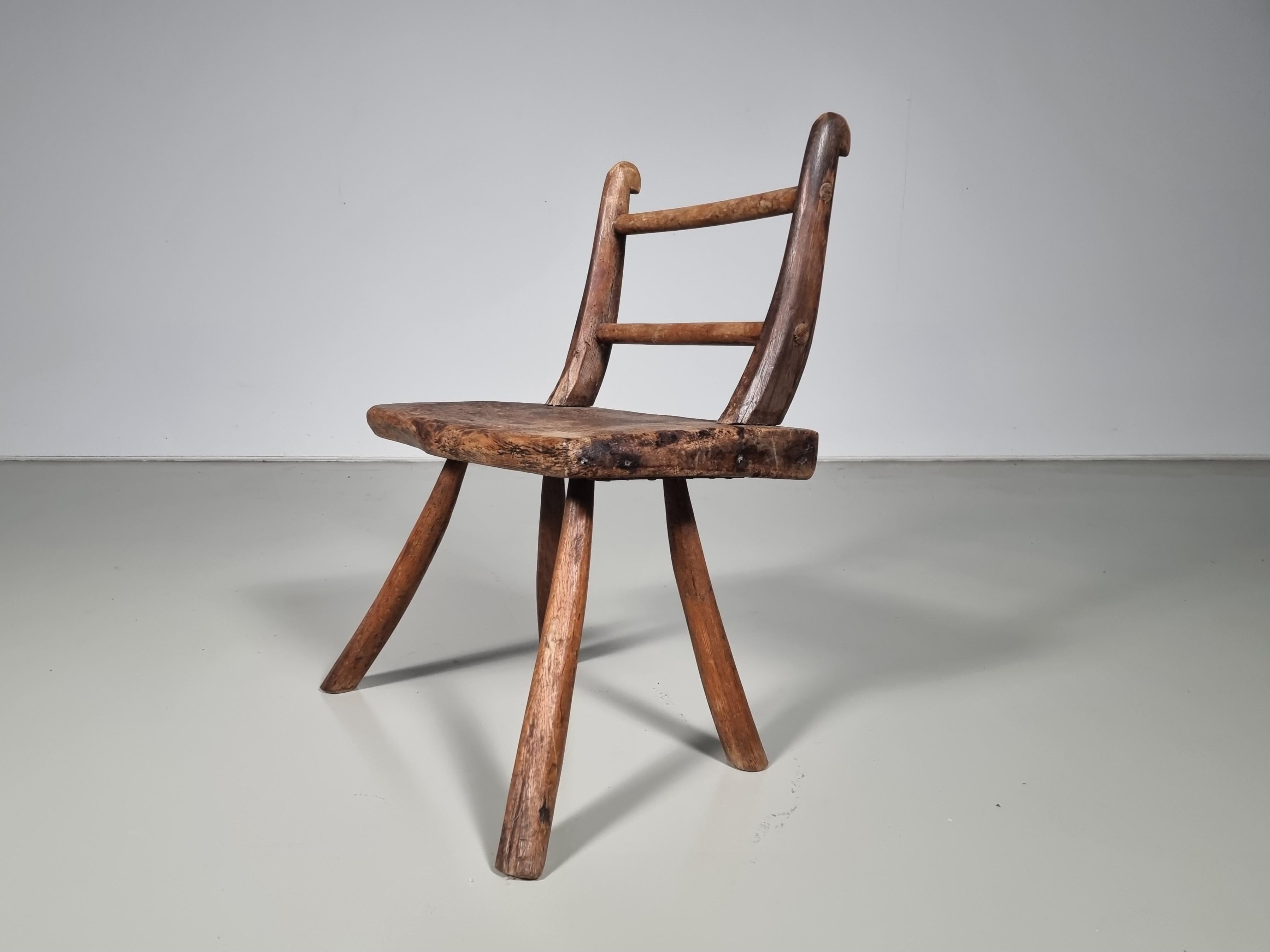 European Rustic Wabi-Sabi Style Side Chair Constructed of Curved Dark Hardwood, 1900s For Sale
