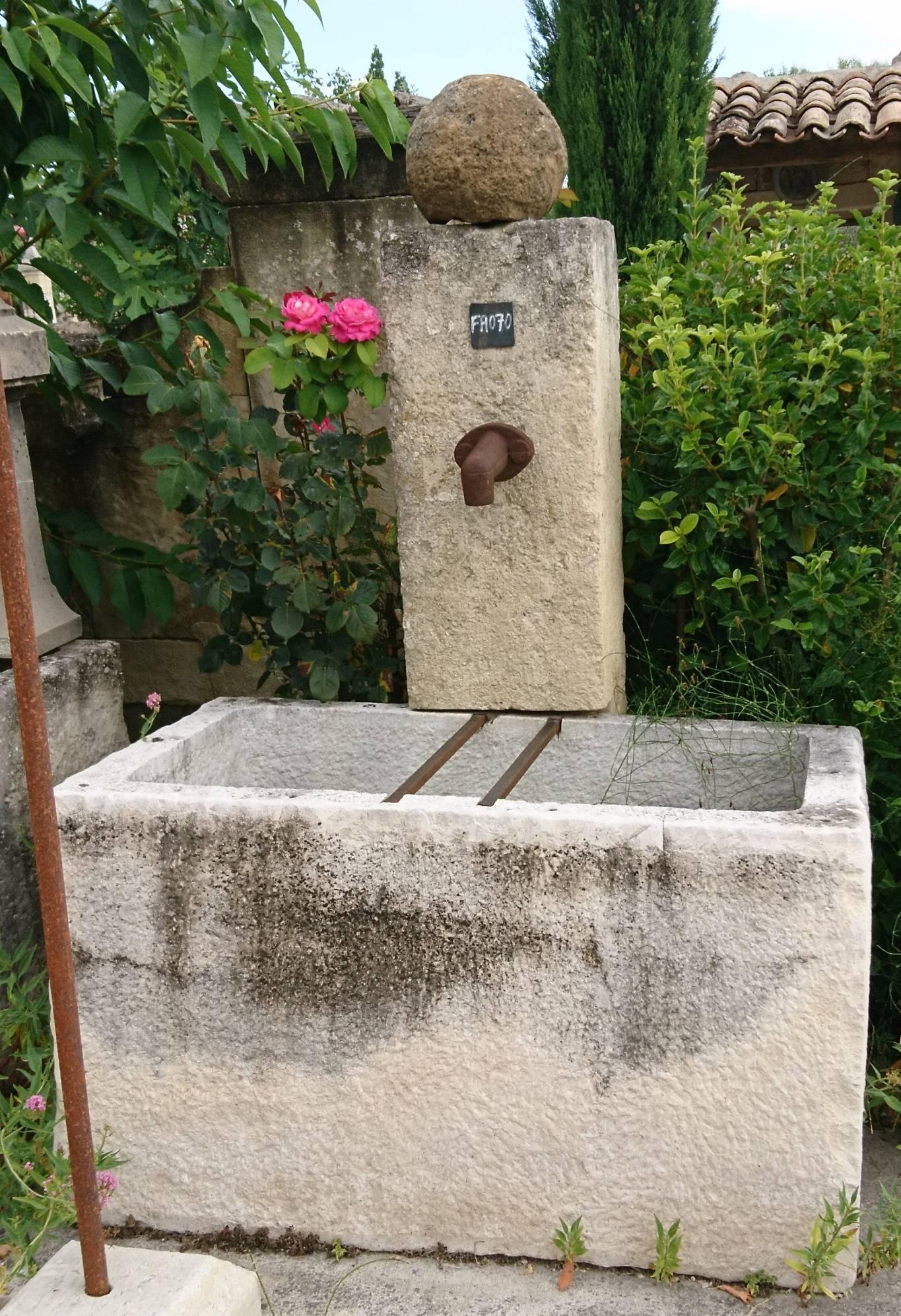 This lovely ornamental fountain is a 100% handcrafted garden fountain made with authentic reclaimed materials, one of the kind fountain 100% made in Provence!

This wall fountain consists of a large rectangular basin carved in a white hard stone