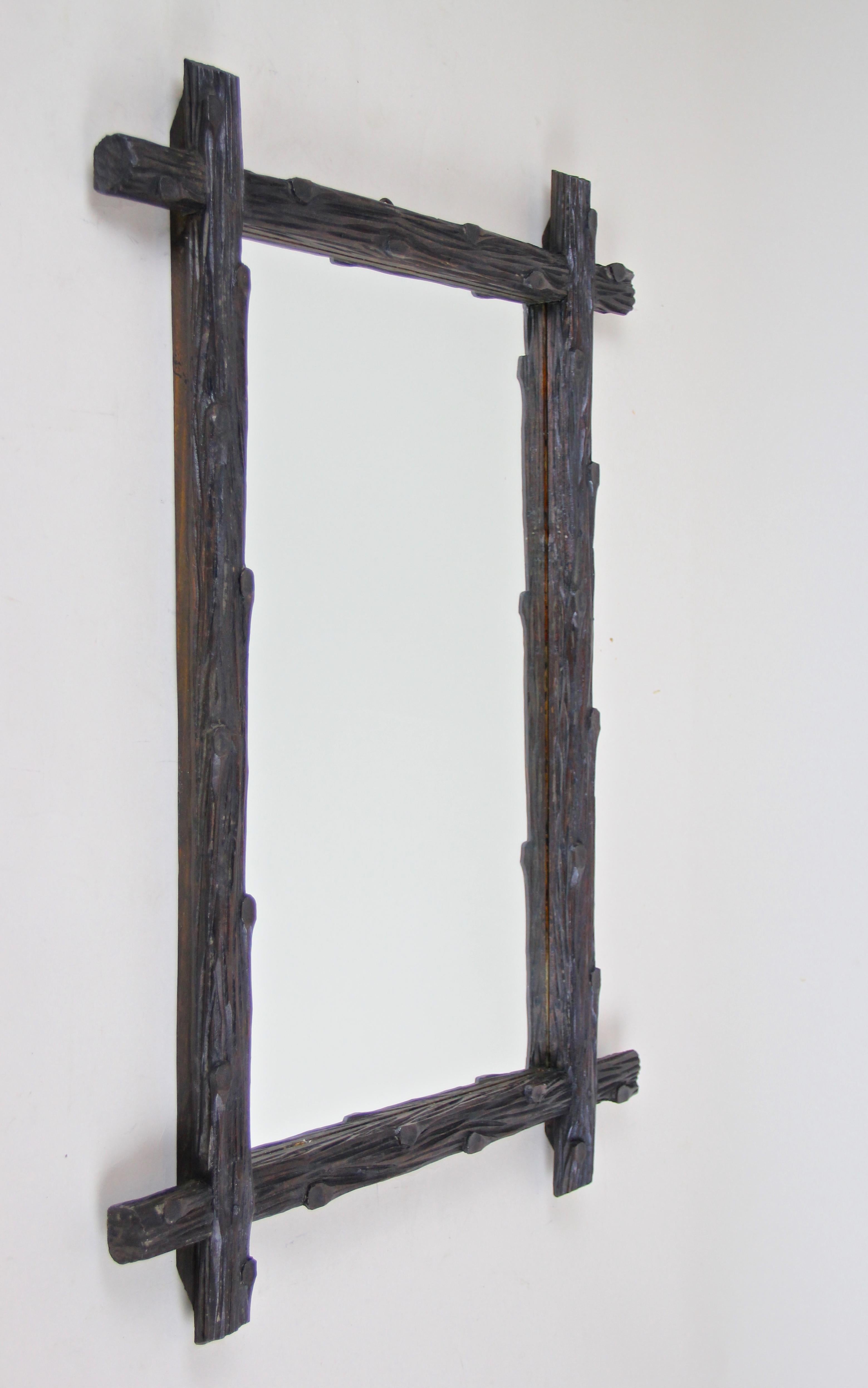 Lovely rustic hand carved Black Forest wall mirror from Austria, circa 1870. This so-called 