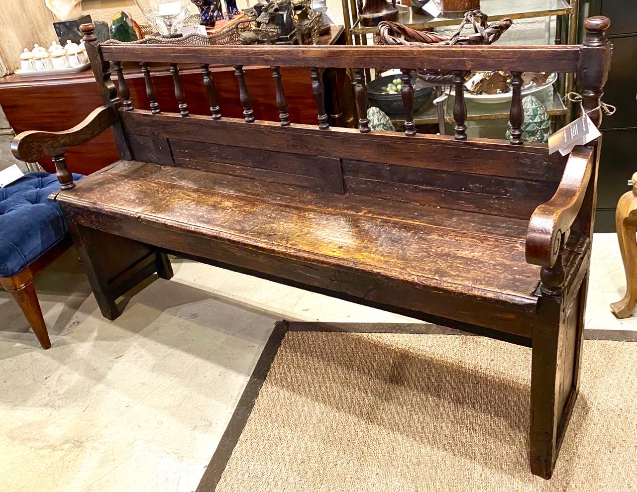 This is a highly decorative walnut farm house bench that dates to the late 18th or early 19th century bench that is most probably French in origin. The bench was fabricated using discarded wood elements from other projects.