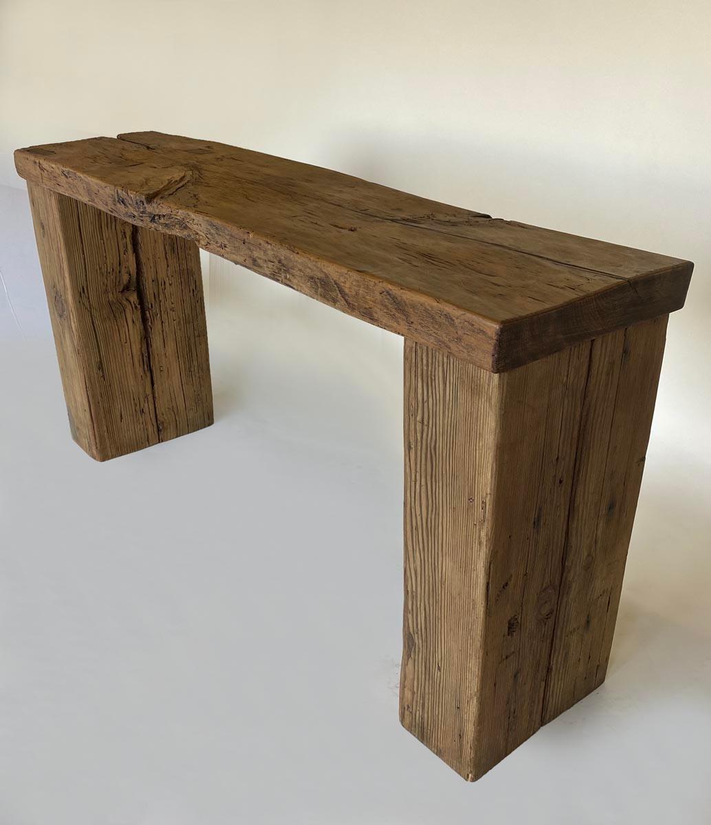 Rustic waterfall style console consisting of a 19th century one wide board of cipres wood atop reclaimed you fir beams. Weathered rustic finish but top is still very smooth to the touch.