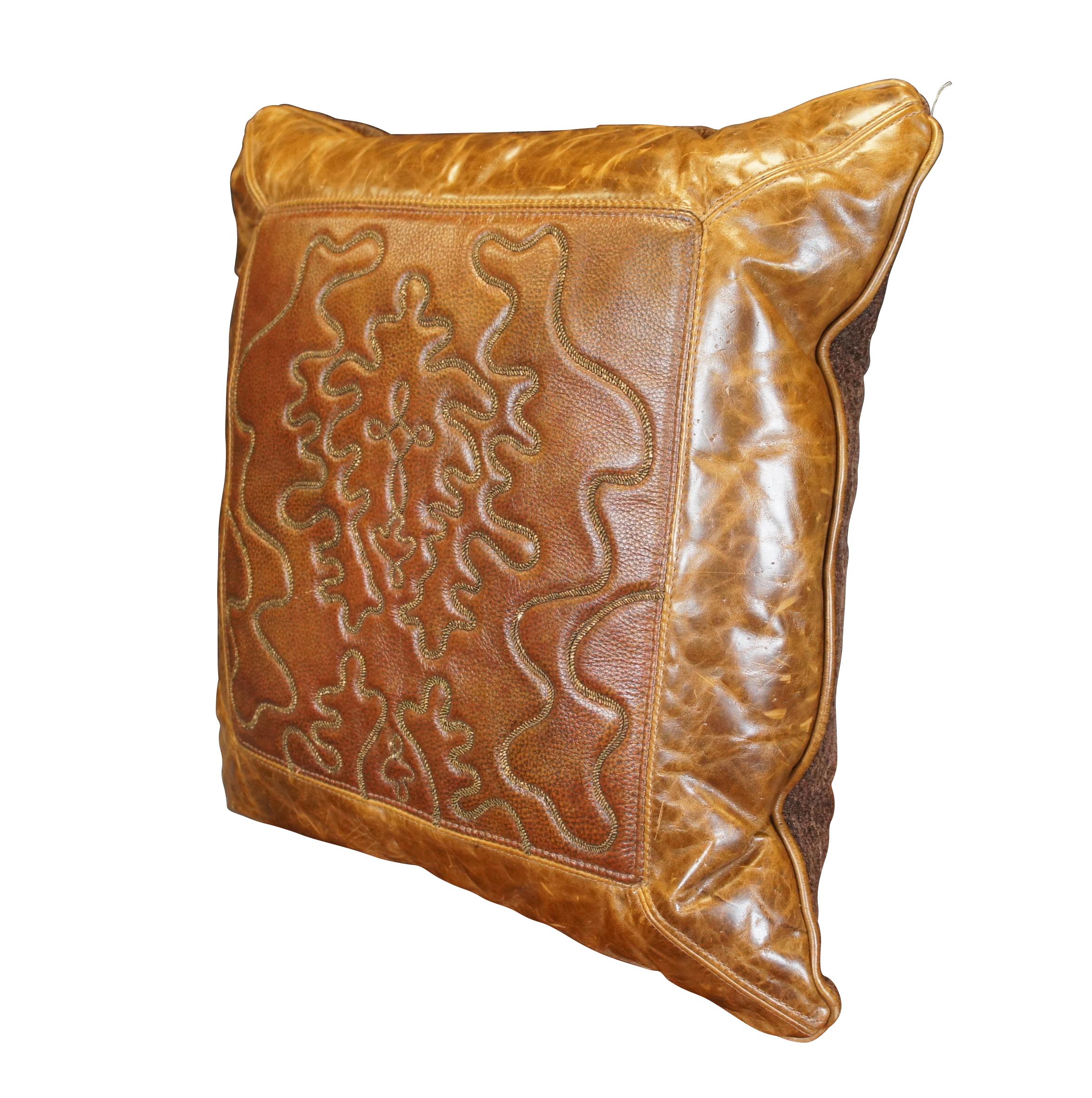Large vintage Western / Southwestern down filled square throw / accent pillow, thick brown pebbled leather front decorated with a stitched abstract bolo design, framed in smooth leather. Brown fabric back. Zipper closure.  Purchased from Bugaboo