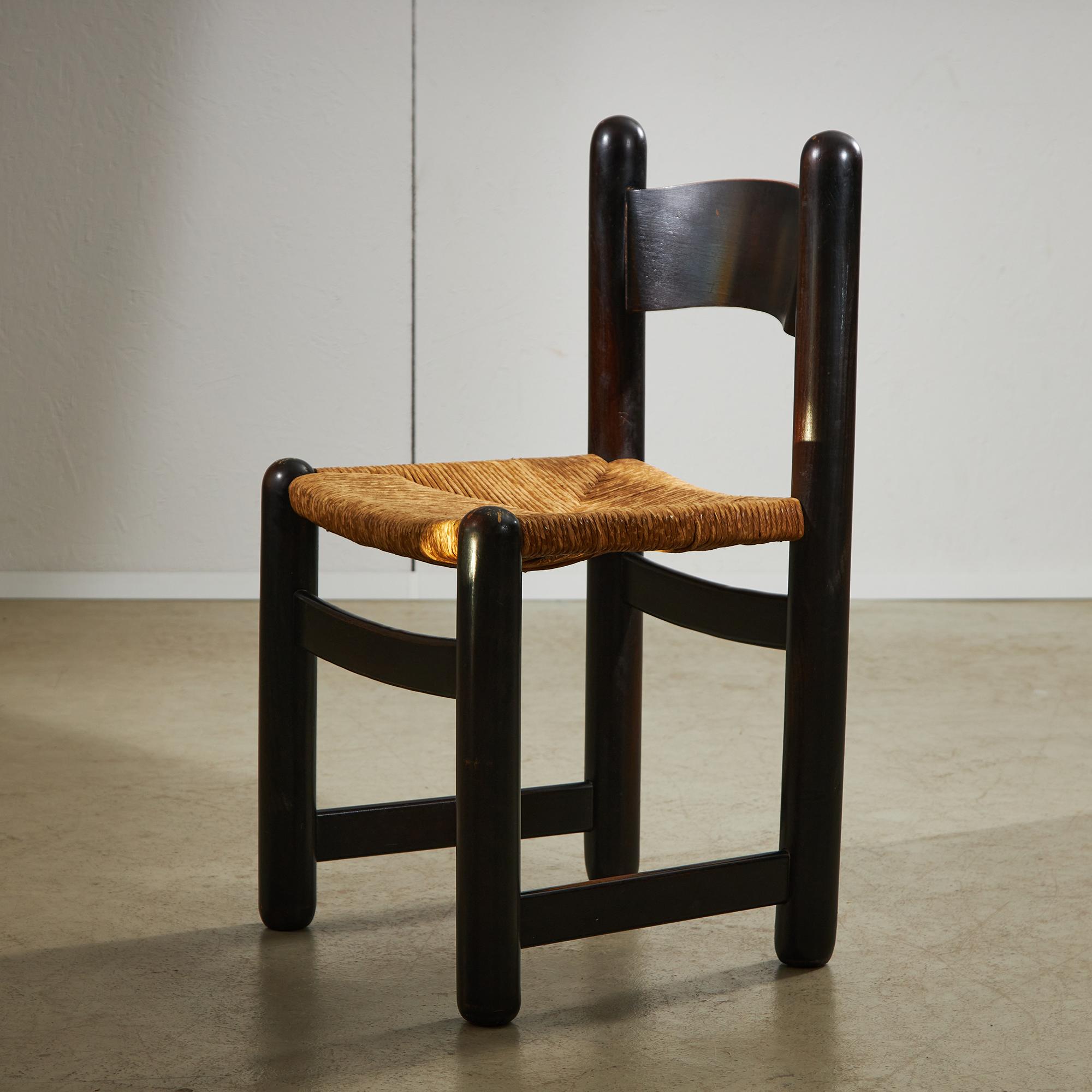 This rustic wicker chair has an easy charm that works in almost any setting. The solid wooden frame, finished in a rich brown, is paired with beautifully handwoven wicker on the seat and backrest. Rounded legs give it a sturdy, grounded feel, while