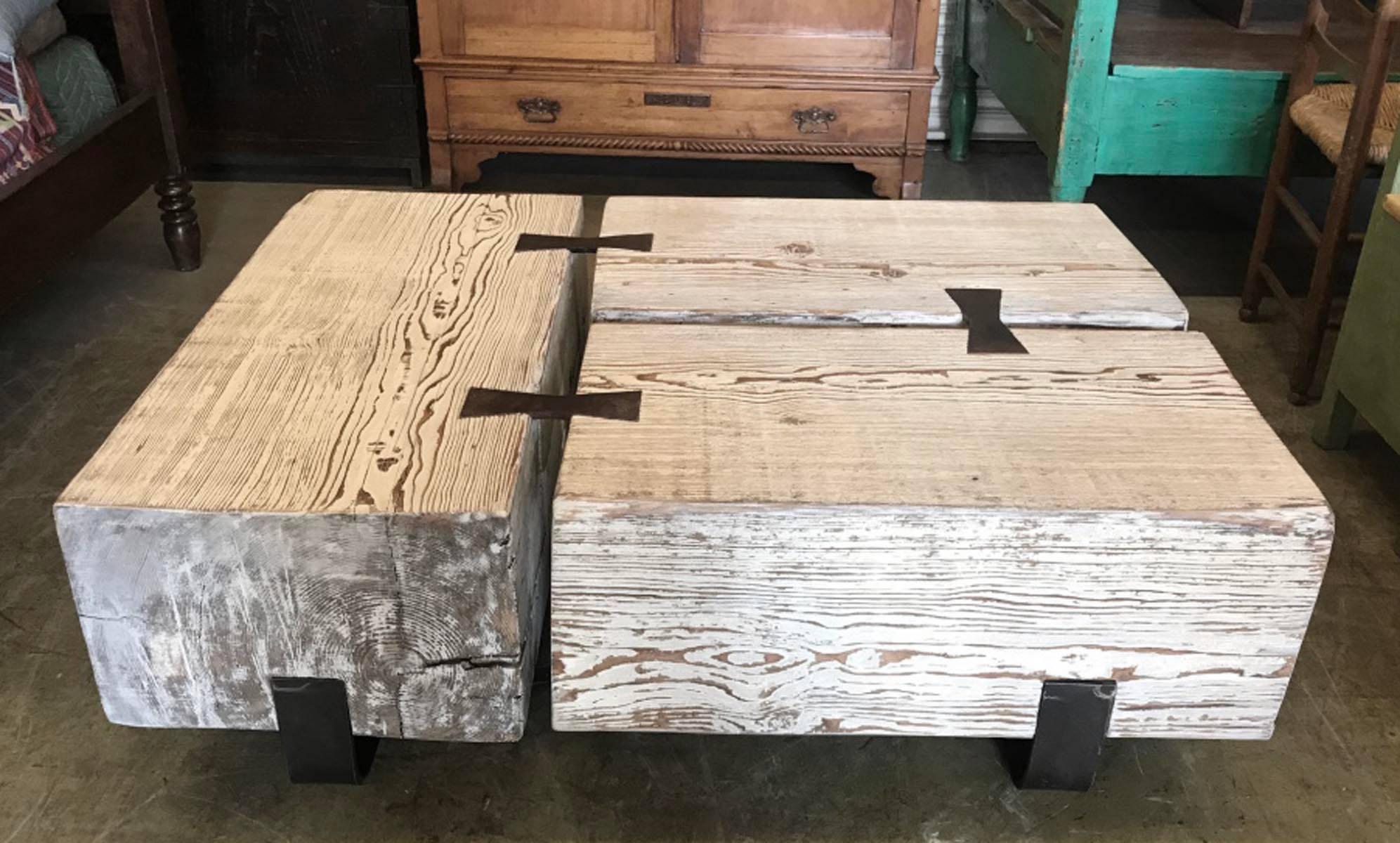 White washed old beams used to make a primitive, rustic coffee table. Hand-forged iron base and iron mariposa (butterfly) inserts in wood.
Very handsome piece.
       