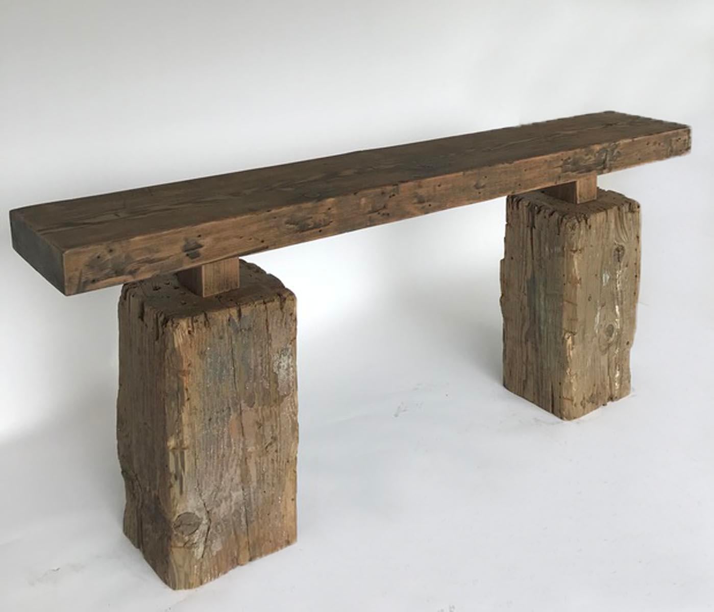 Reclaimed wood 3.5 inch top on antique Guatemalan cipres wood bases. Bases show traces of old paint. Rustic with clean lines. Functional, sturdy and a one of a kind console table.