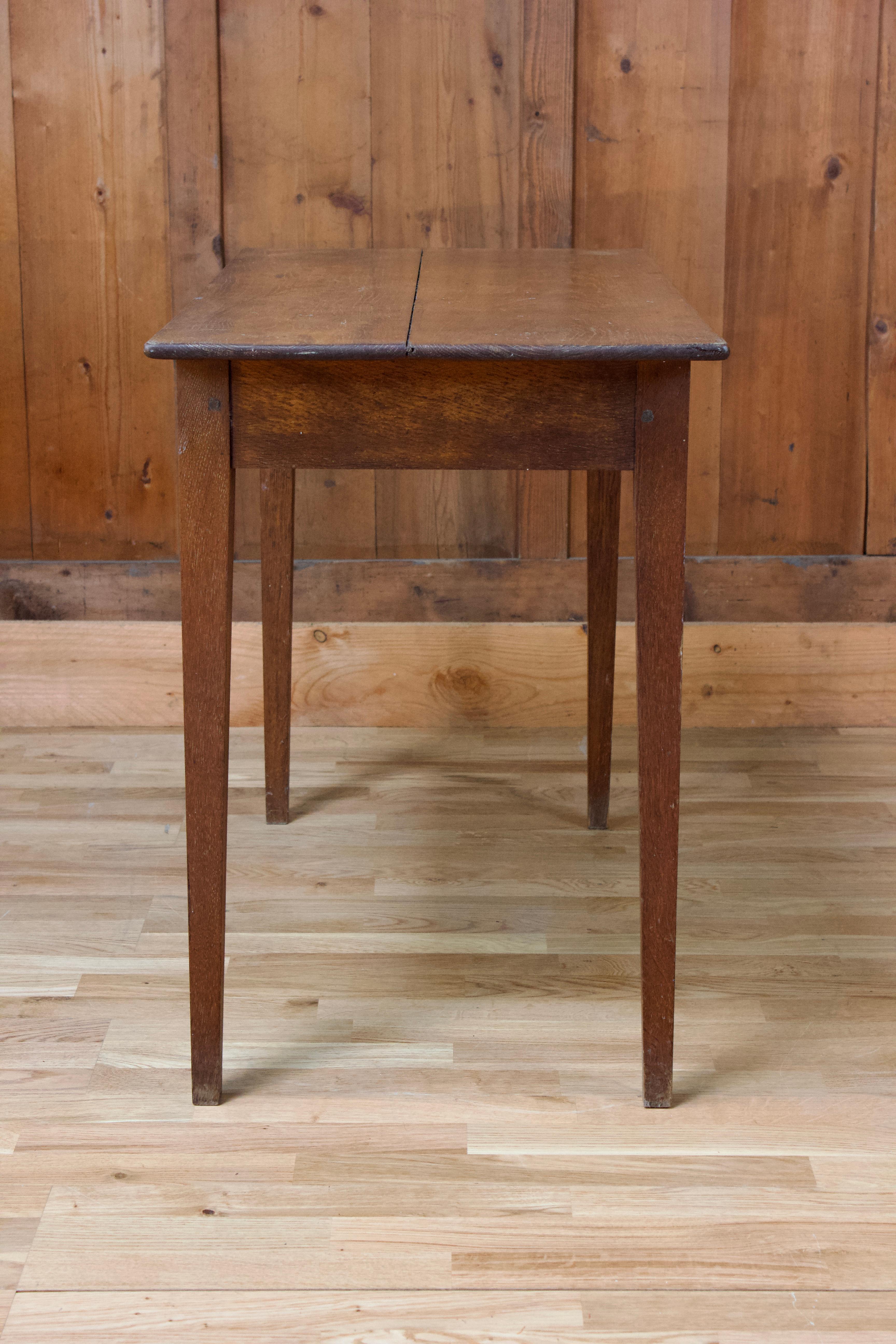 Small rustic wooden desk table with a belt drawer.