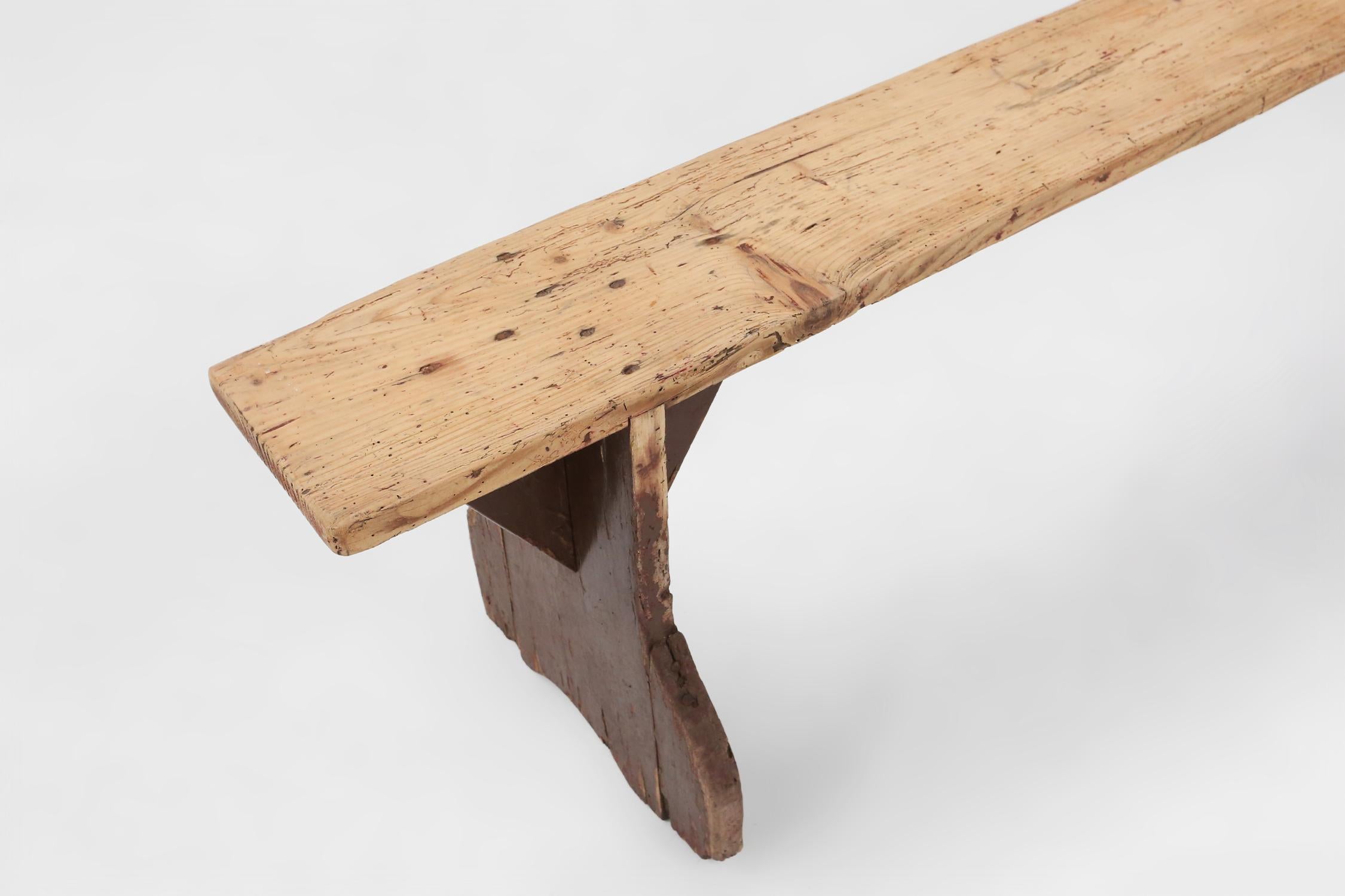French Rustic wooden bench in with brown painted feet, France ca. 1890 For Sale