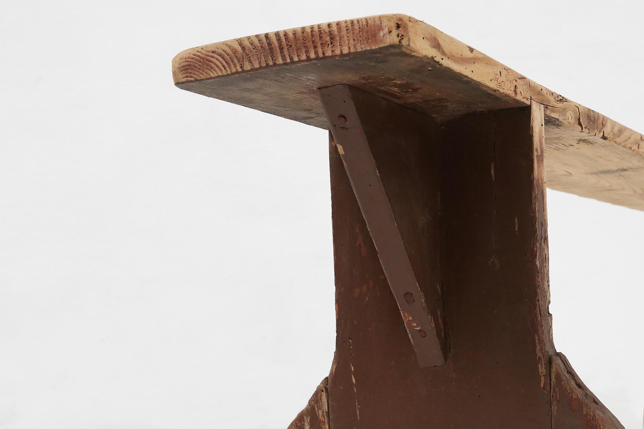 Late 19th Century Rustic wooden bench in with brown painted feet, France ca. 1890 For Sale