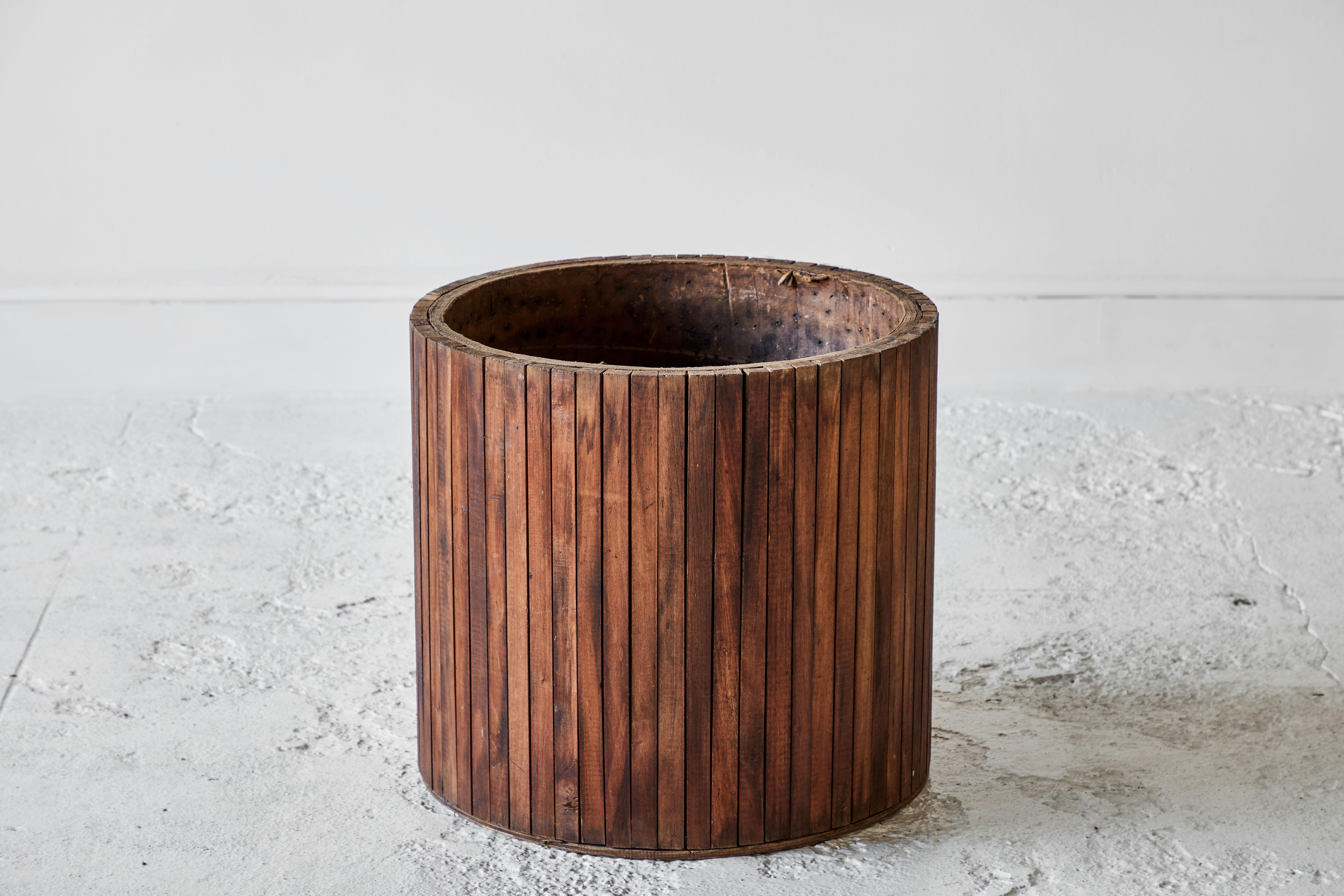 Rustic round wooden faceted planter.