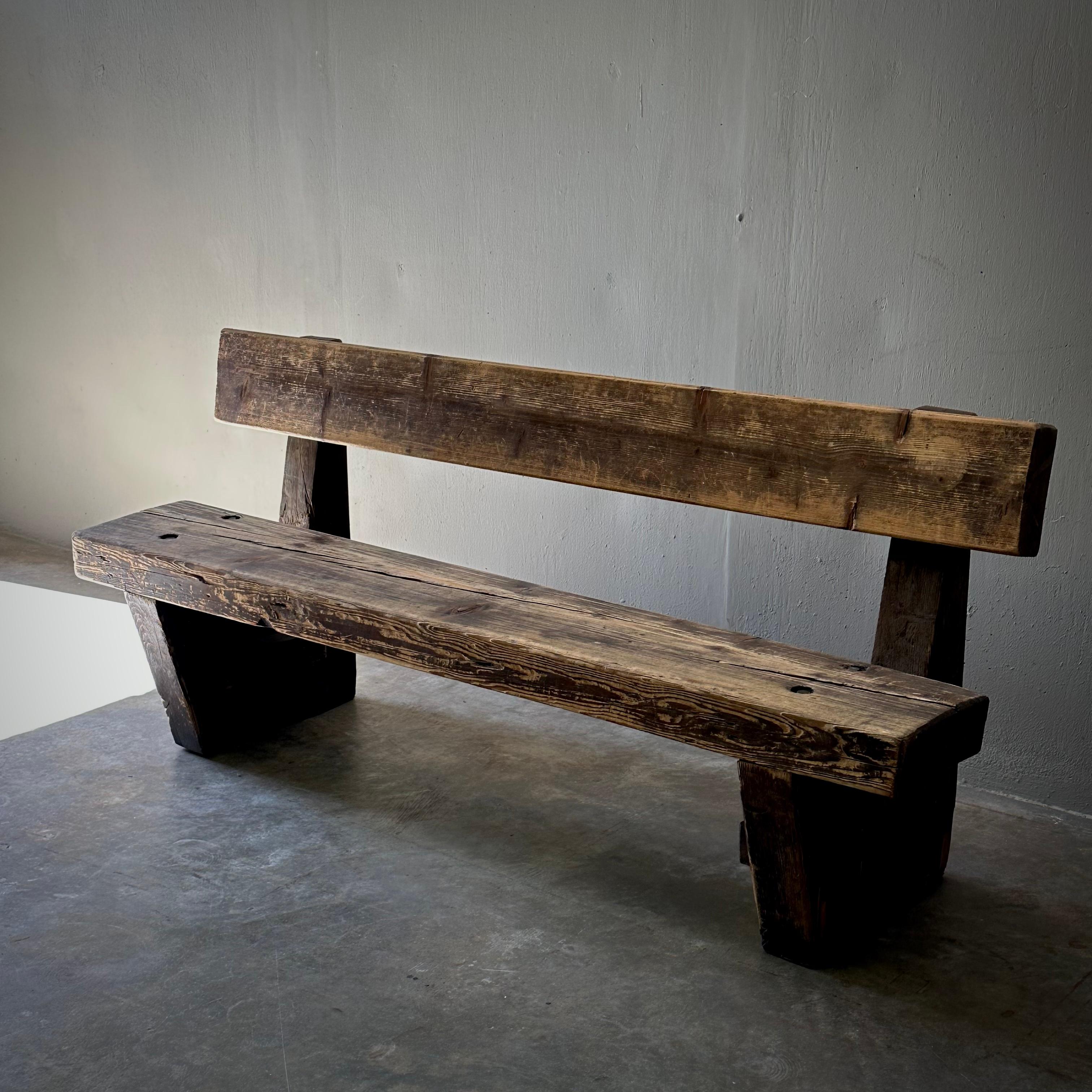 Rustic 19th century wooden bench, originally from a former pub in the city of Amsterdam. Would work well in any hallway, entry, or semi-covered patio space, with its humble silhouette and beautifully aged wood. An easy way of infusing a touch of