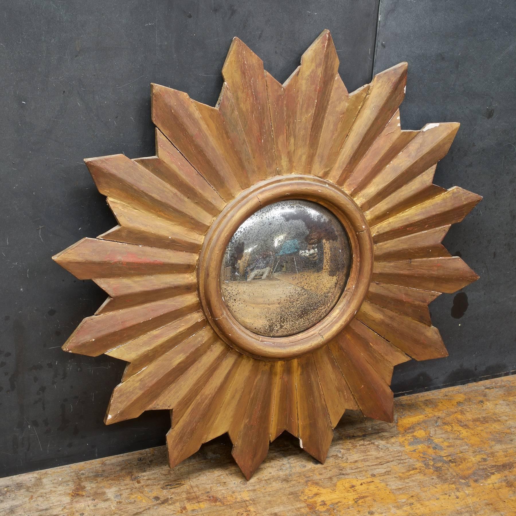 Rather large at almost 3 feet in diameter. A heavily Patinated and worn wall mirror, ready to hang, Revival design probably made in the midcentury era.
    