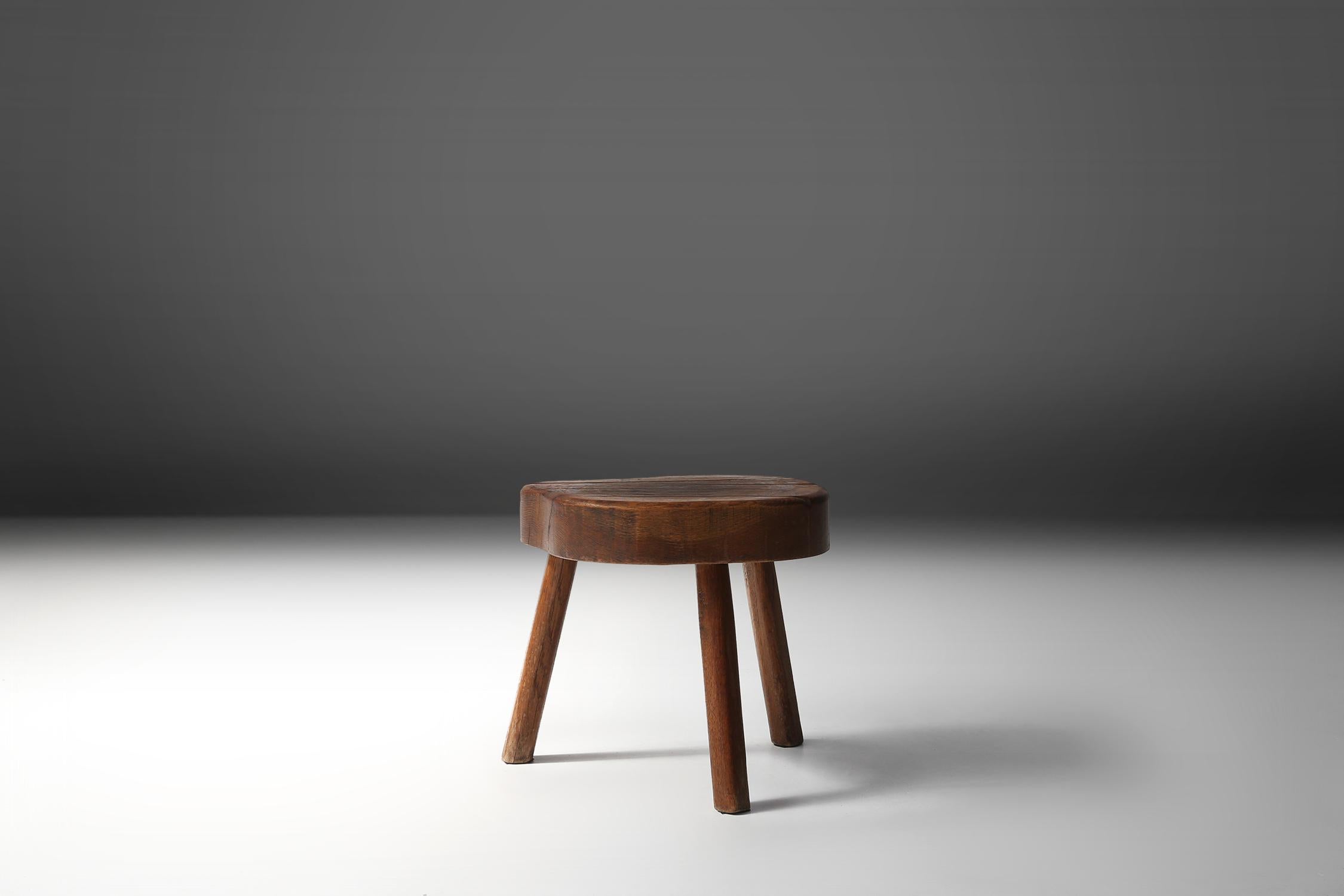 Small wooden stool made of a solid piece of tree.
Has a rustic and Wabi-Sabi look.