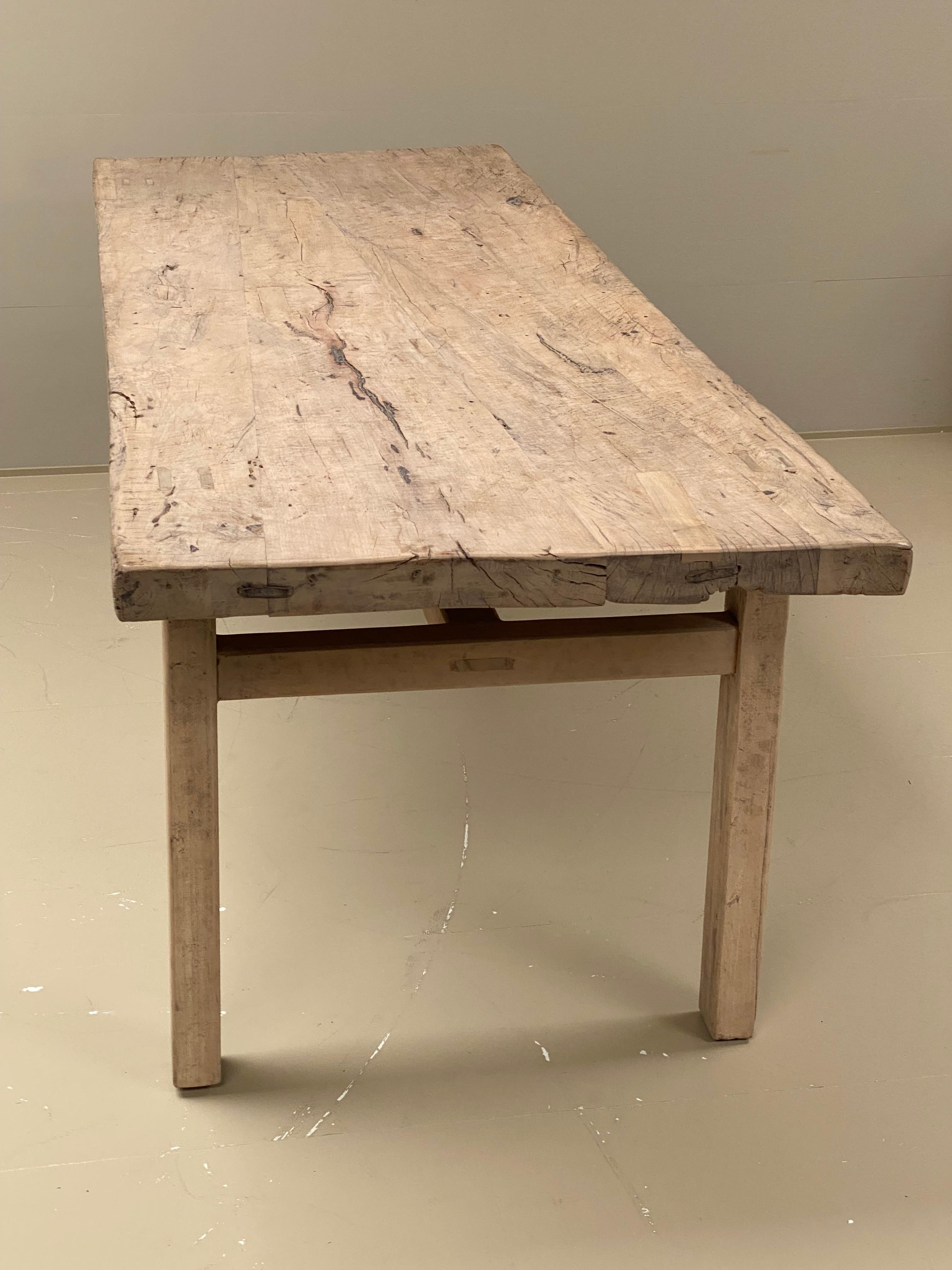 Beautiful rustic French weathered farm table in bleached elm wood,
French Pyrenees from around 1960ties,
good great old patina and a warm and worn finish,
ideal table to put in a kitchen as a dining table or as a working table,
table with a good