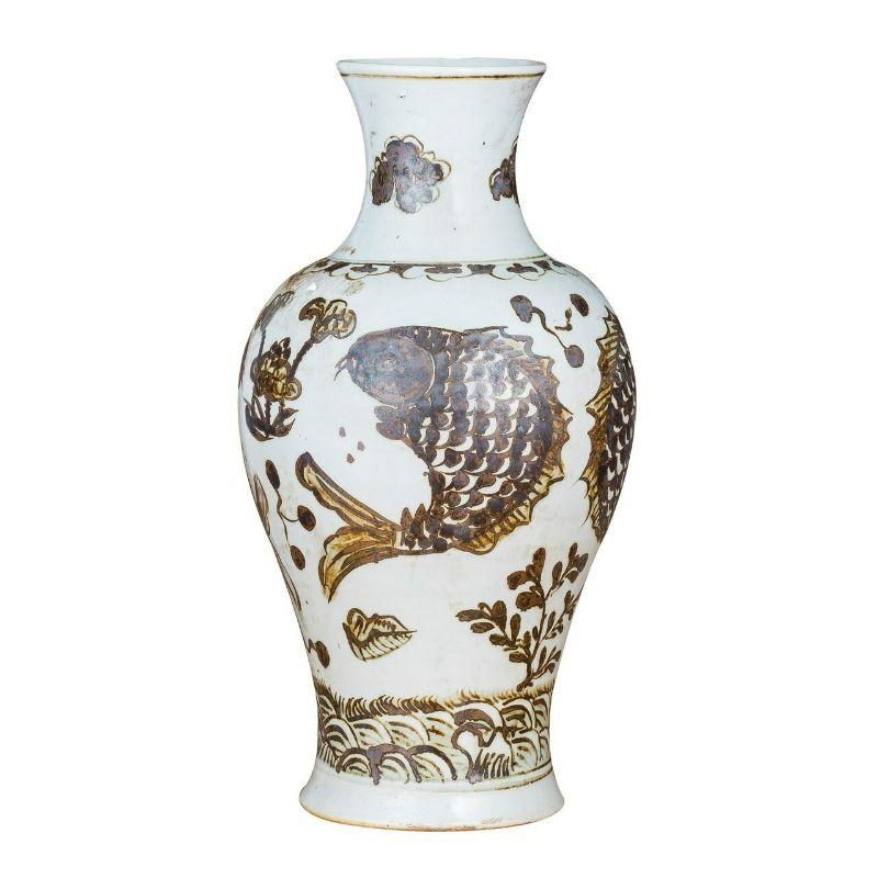 Rusty brown vase fish lotus motif

The special antique process makes it looks like a piece of art from a museum. 
High fire porcelain, 100% hand shaped, hand painted. Distress, chips and other imperfections create great characters of this special