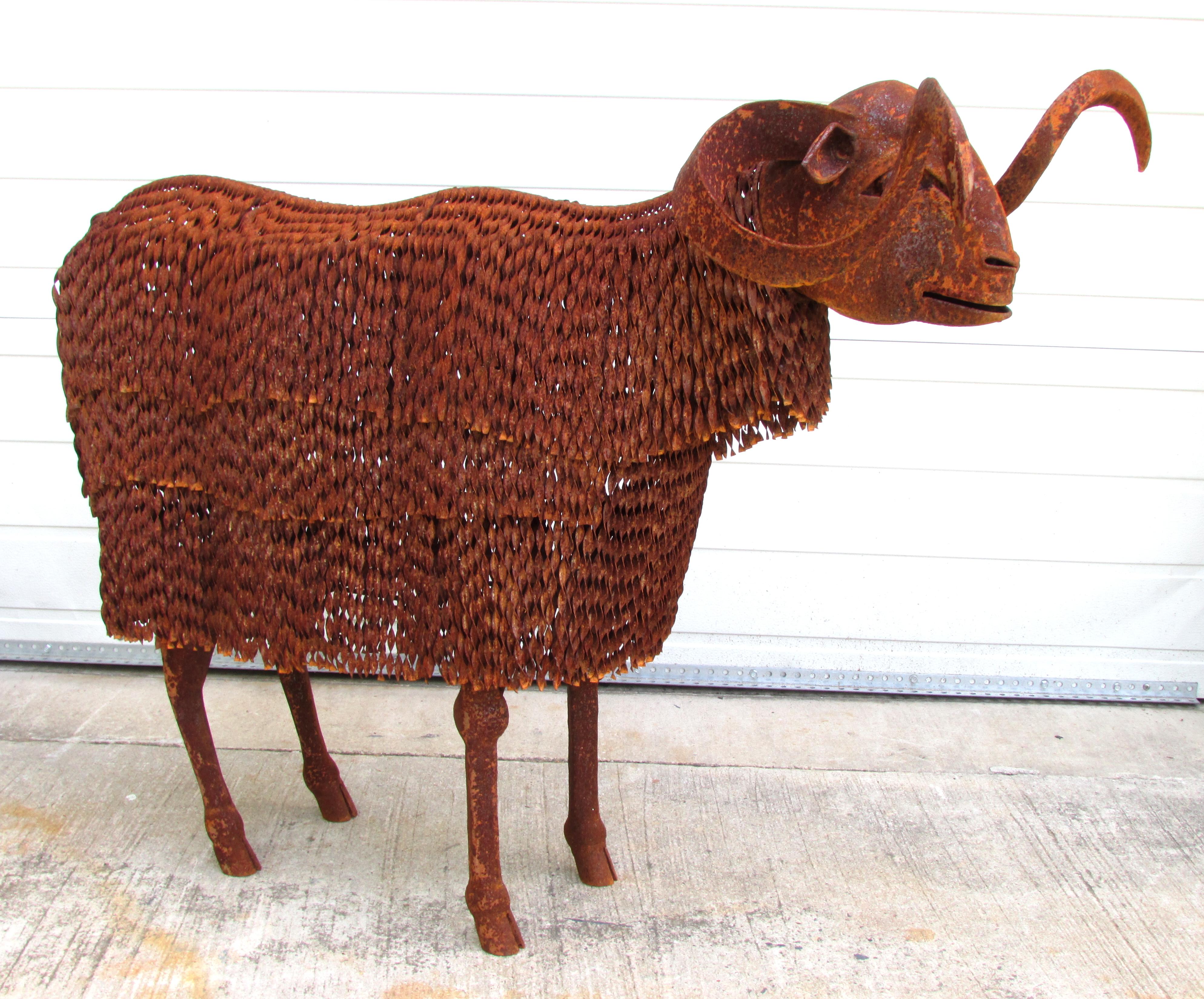 Lifesize shaggy sheep artist made from rusty metal.