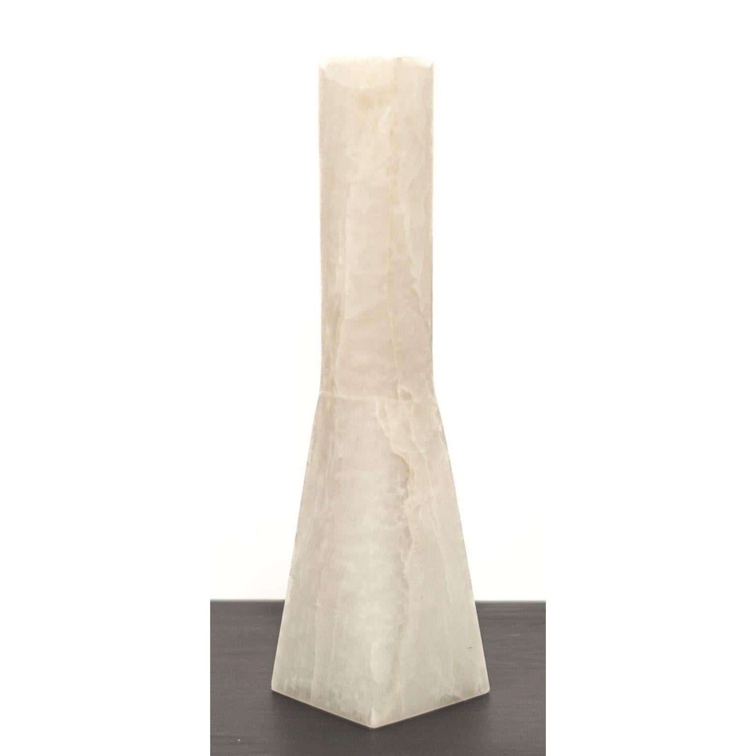 Ruta Vase by Lucas Tyra Morten
Limited Edition Of 10 Pieces.
Dimensions: W 10 x D 19 x H 40 cm.
Material: Natural onyx stone.

Occupying the liminal space between art and design, the multidisciplinary atelier of Lucas and Tyra Morten is a small