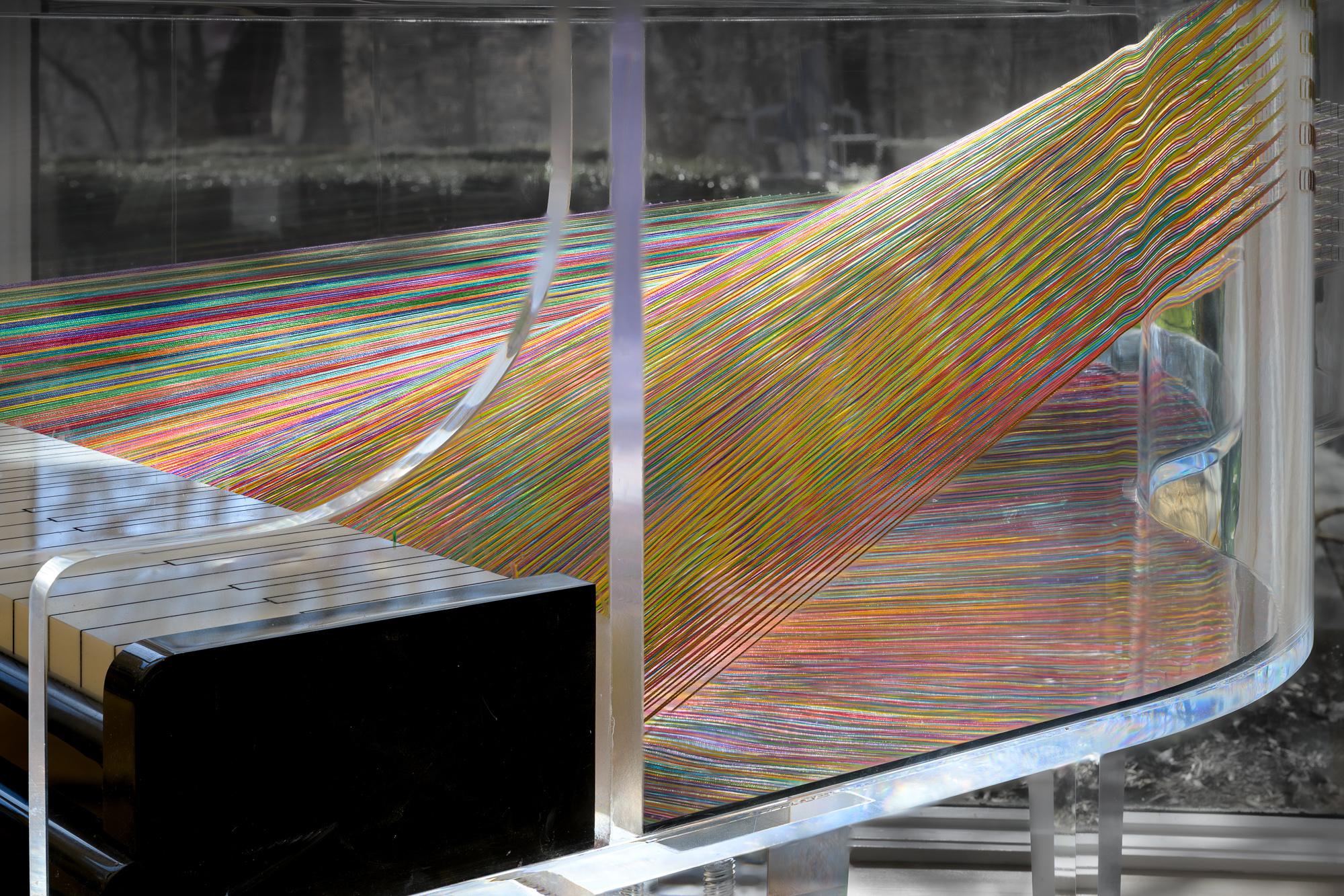 This large contemporary clear acrylic sculpture of a piano was inspired by the artist’s love of music.

This beautiful and magical piece of modern art is the unique vision of an award-winning author and music lover. Years ago, Ruth Kassinger noticed