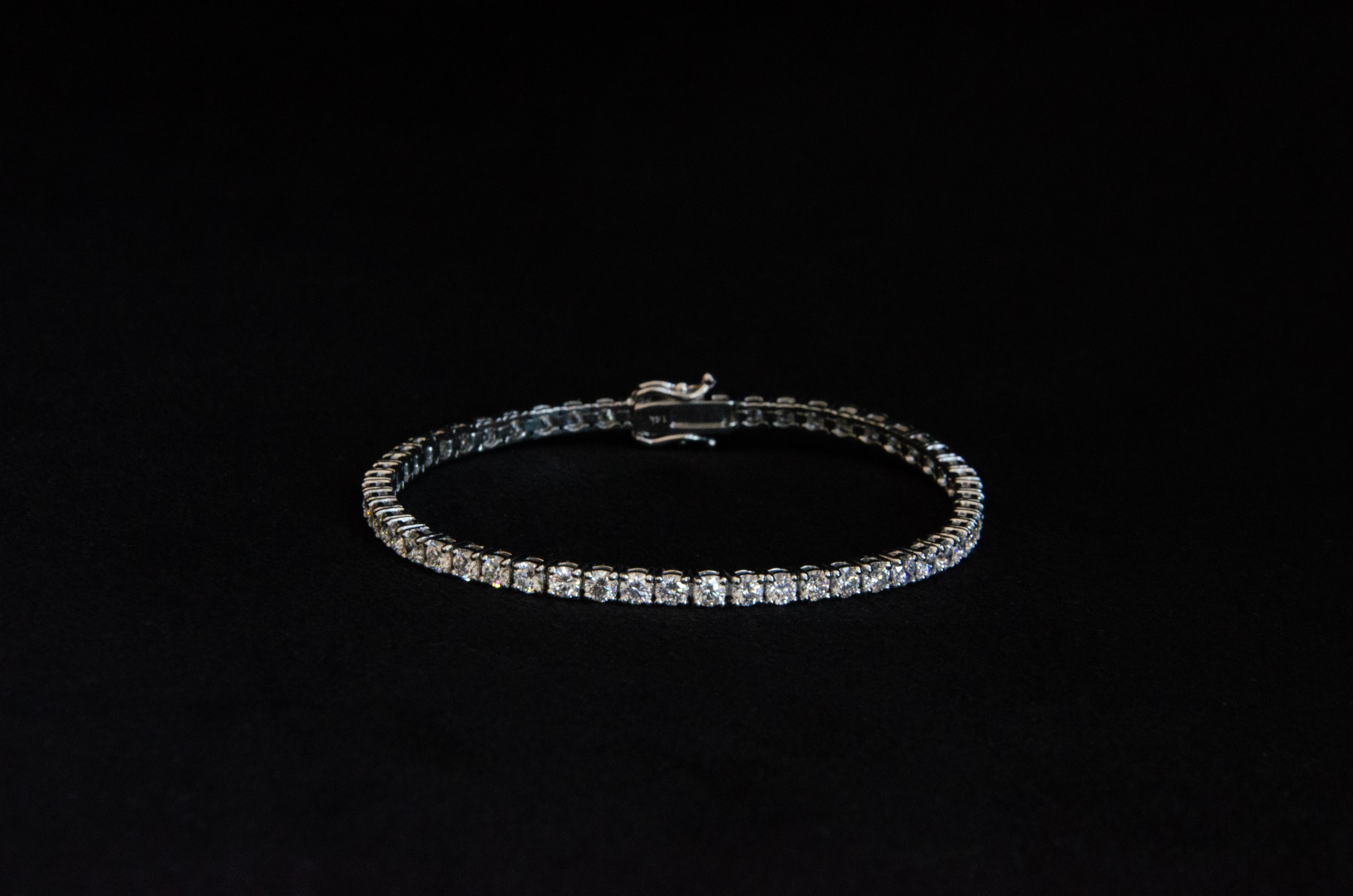 Introducing the Tennis Bracelet - a modern classic crafted with exquisite attention to detail, this bracelet showcases 5 carats of lab-created diamonds delicately set on a 7in 14k white gold bracelet. 

Each Ruth Nyc piece is handmade to order in