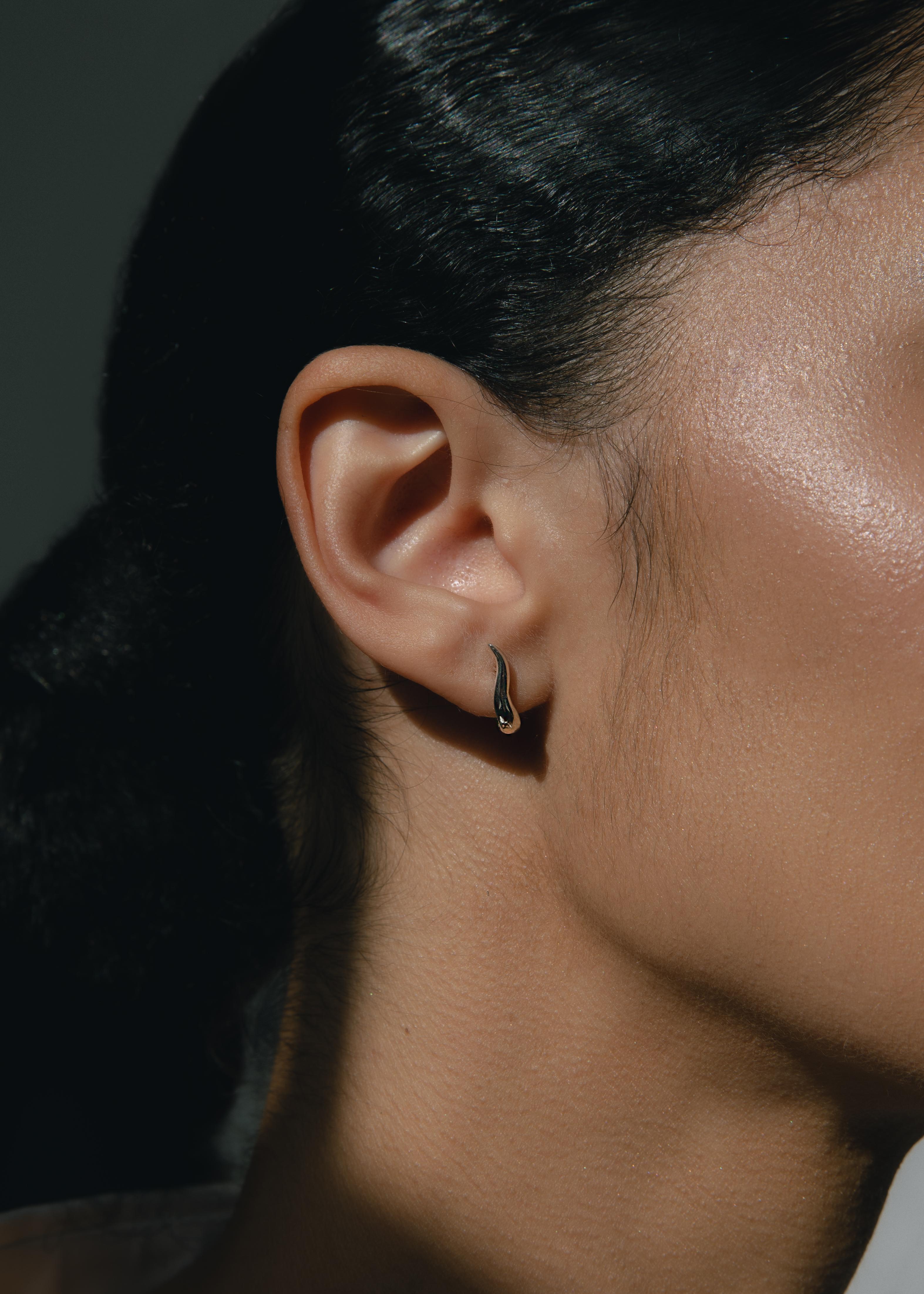 Organically shaped delicate hoops designed to sit closely to your ear.

-14k yellow gold
-post and pushback closure
-sold as a pair

Each Ruth Nyc piece is handmade to order in our NYC studios. Each piece is designed to become a personal talisman, a