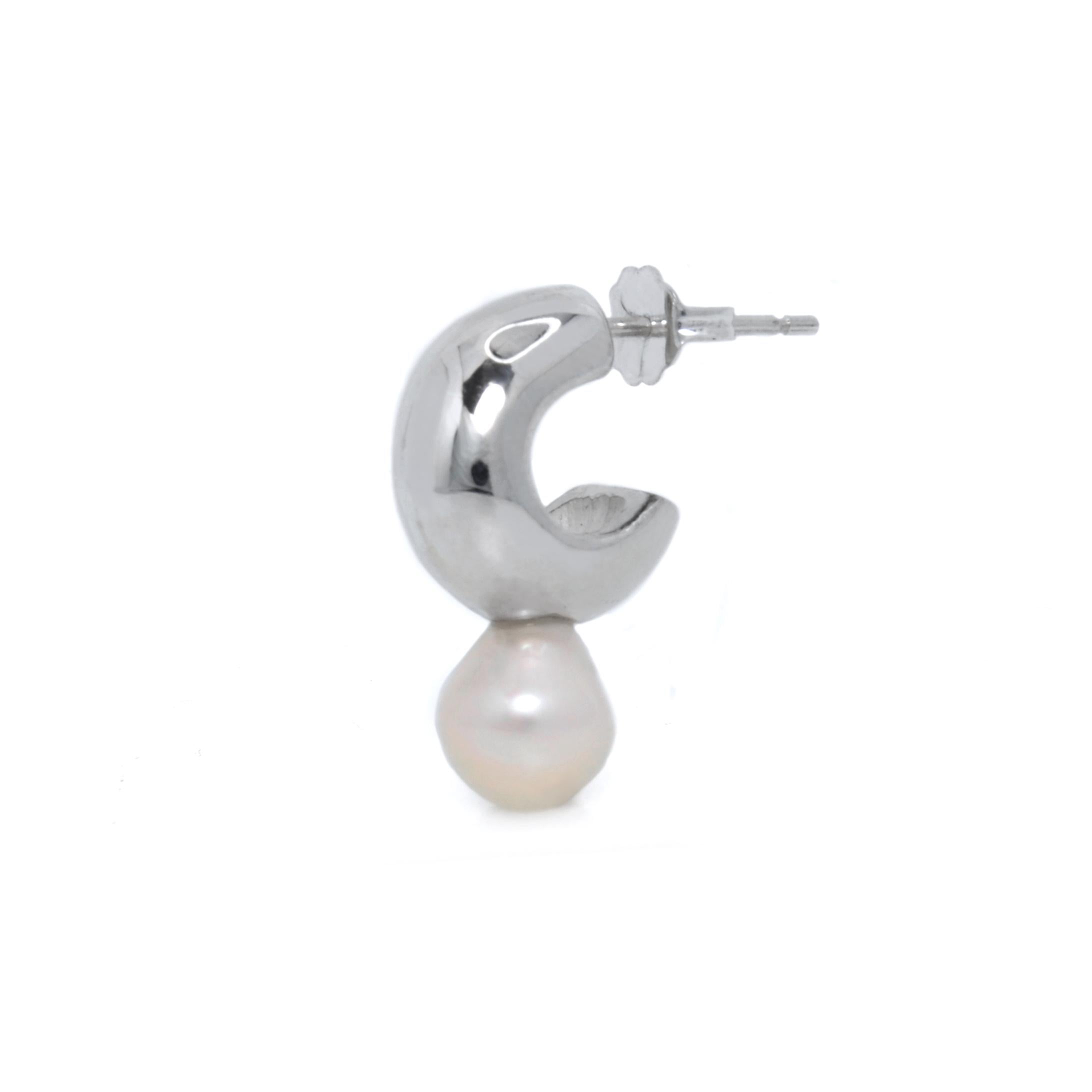 The Melu Huggies, fresh water pearl hoop earrings featuring tear drop pearls in a design that calls to mind the mysterious and mystical sirens of folklore.

Meticulously handcrafted from sterling silver. Pearls may vary slightly in shape and luster