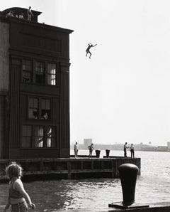 Boy jumping into Hudson River, NYC