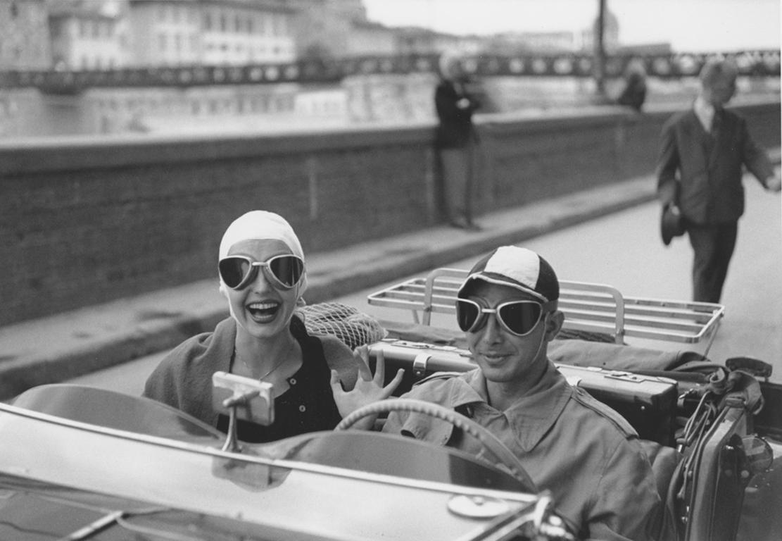 Ruth Orkin Black and White Photograph - Couple in MG, Florence, Italy 