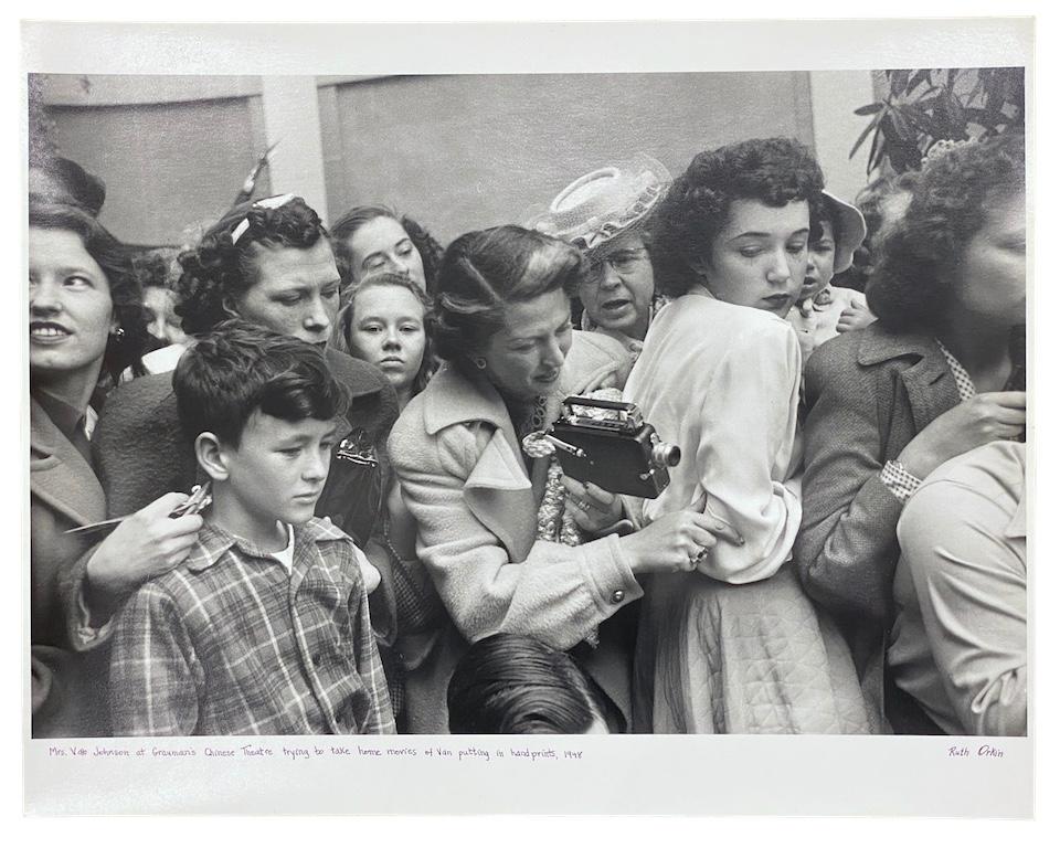 Mrs. Van Johnson at Grauman's Chinese Theatre trying to take home movies of Van - Photograph by Ruth Orkin