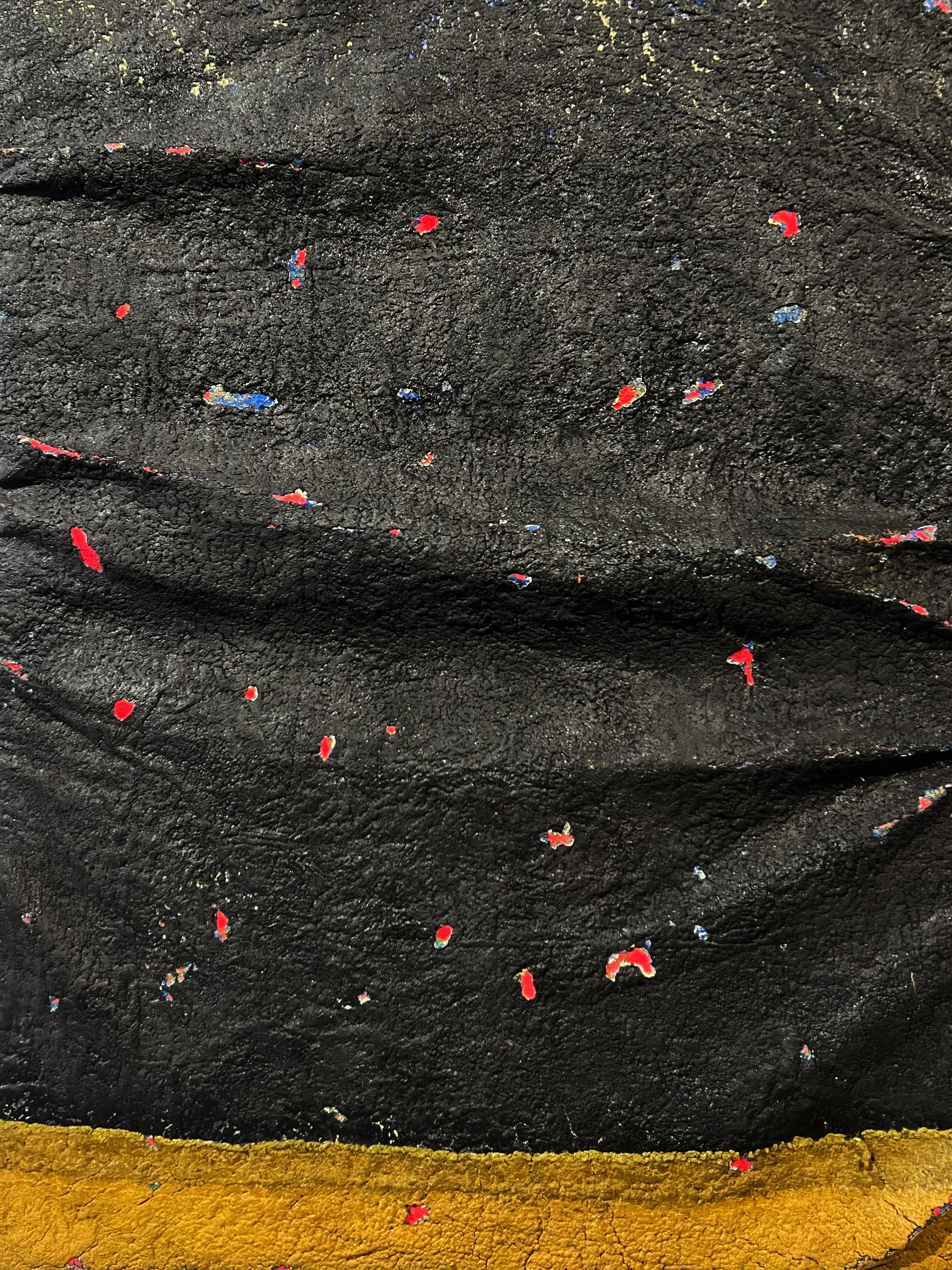 Large inflatable painting, layers and folds on canvas, black, details yellow red