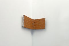 Miniature corner sculpture, ceramic and concrete brick wall, architecture