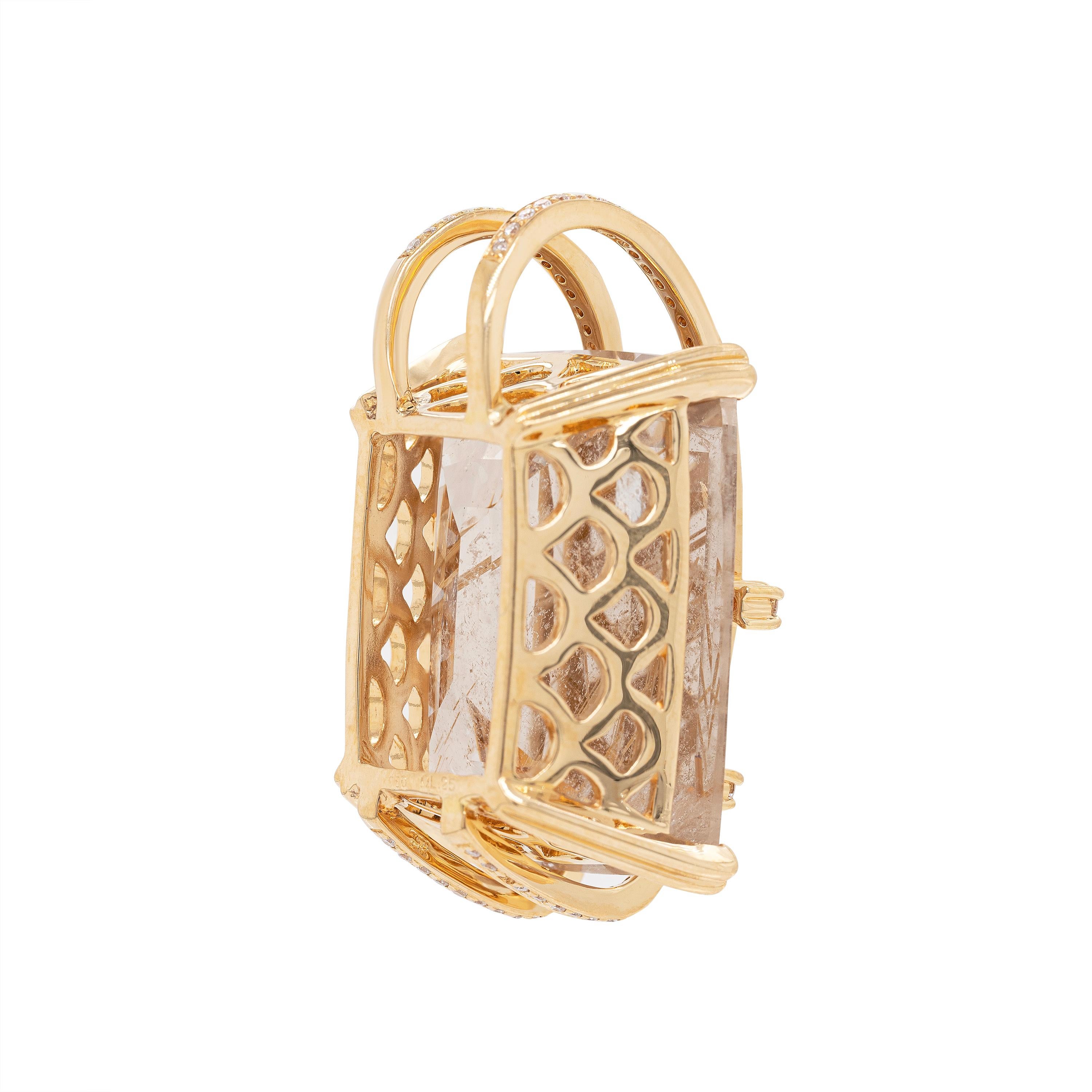 This one of a kind 18 carat yellow gold pendant features a spectacular 25 x 19.5mm cushion shaped rutilated quartz mounted in a four double claw, open work mount. The pendant's bale is shaped from two 18 carat rose gold branches that compliment the