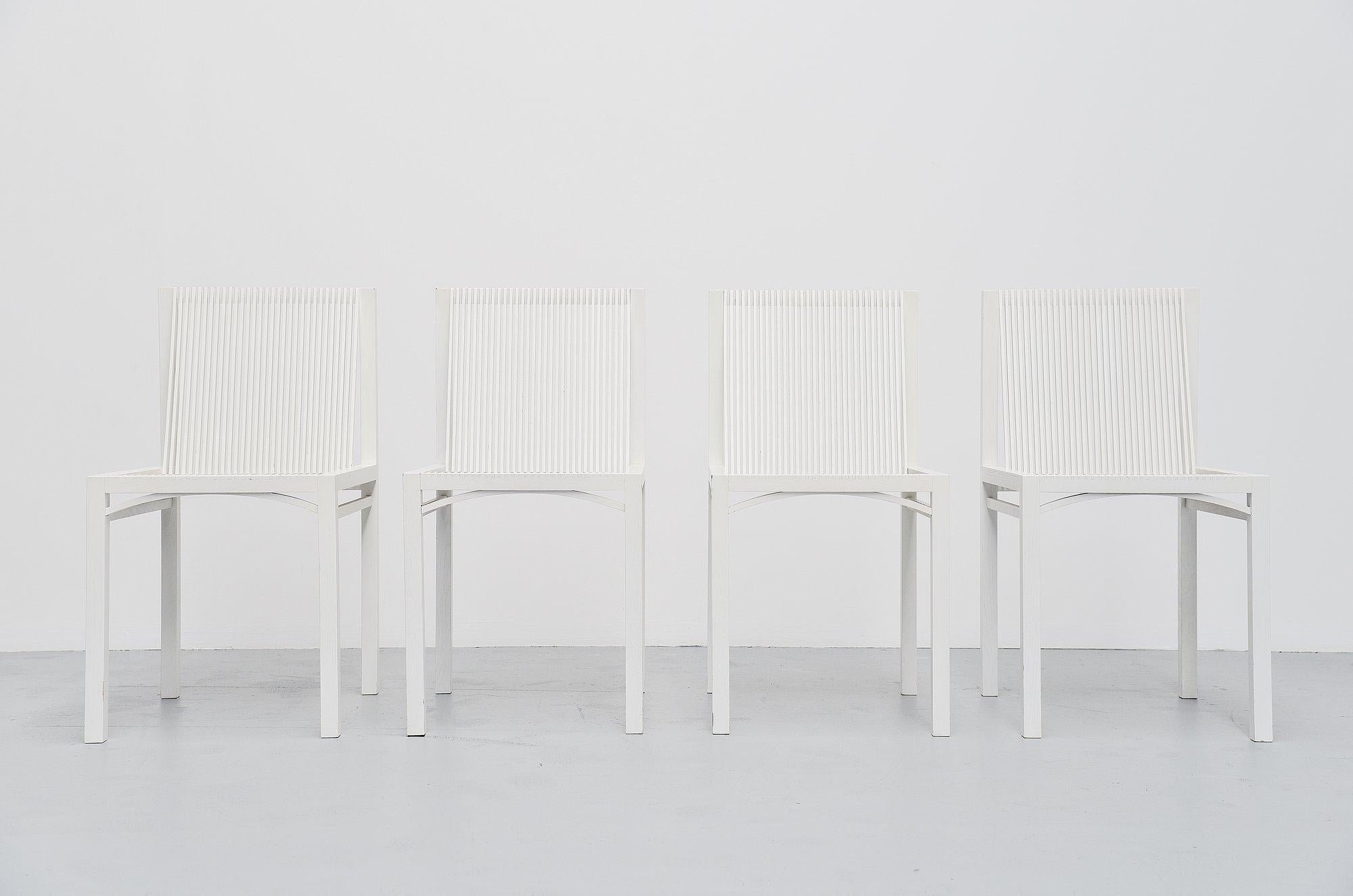 Very nice dining set of 4 dining chairs designed by Ruud Jan Kokke and manufactured by Metaform, Holland 1984. The chairs are made of white lacquered birch wooden slats, glued and joint without screws or nails. The chairs have a very nice structural